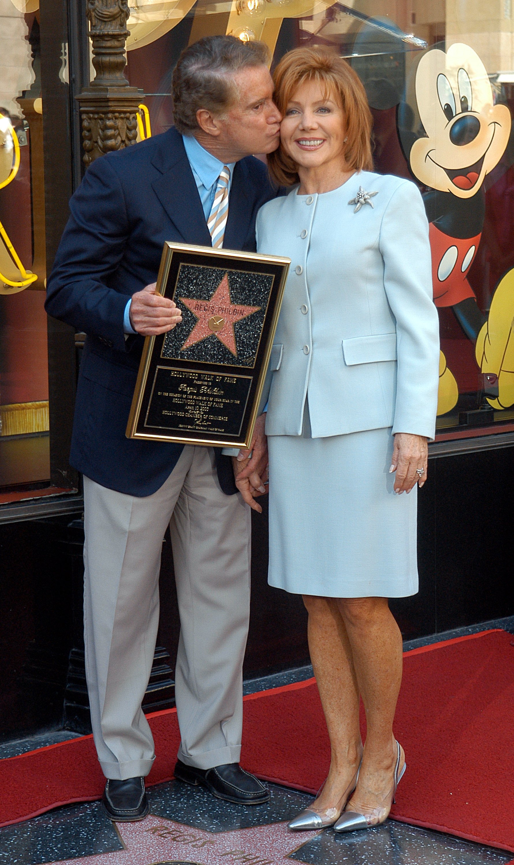 Regis Philbin kisses wife Joy Philbin while receiving Hollywood Walk of Fame Star on April 10, 2003 | Photo: Getty Images