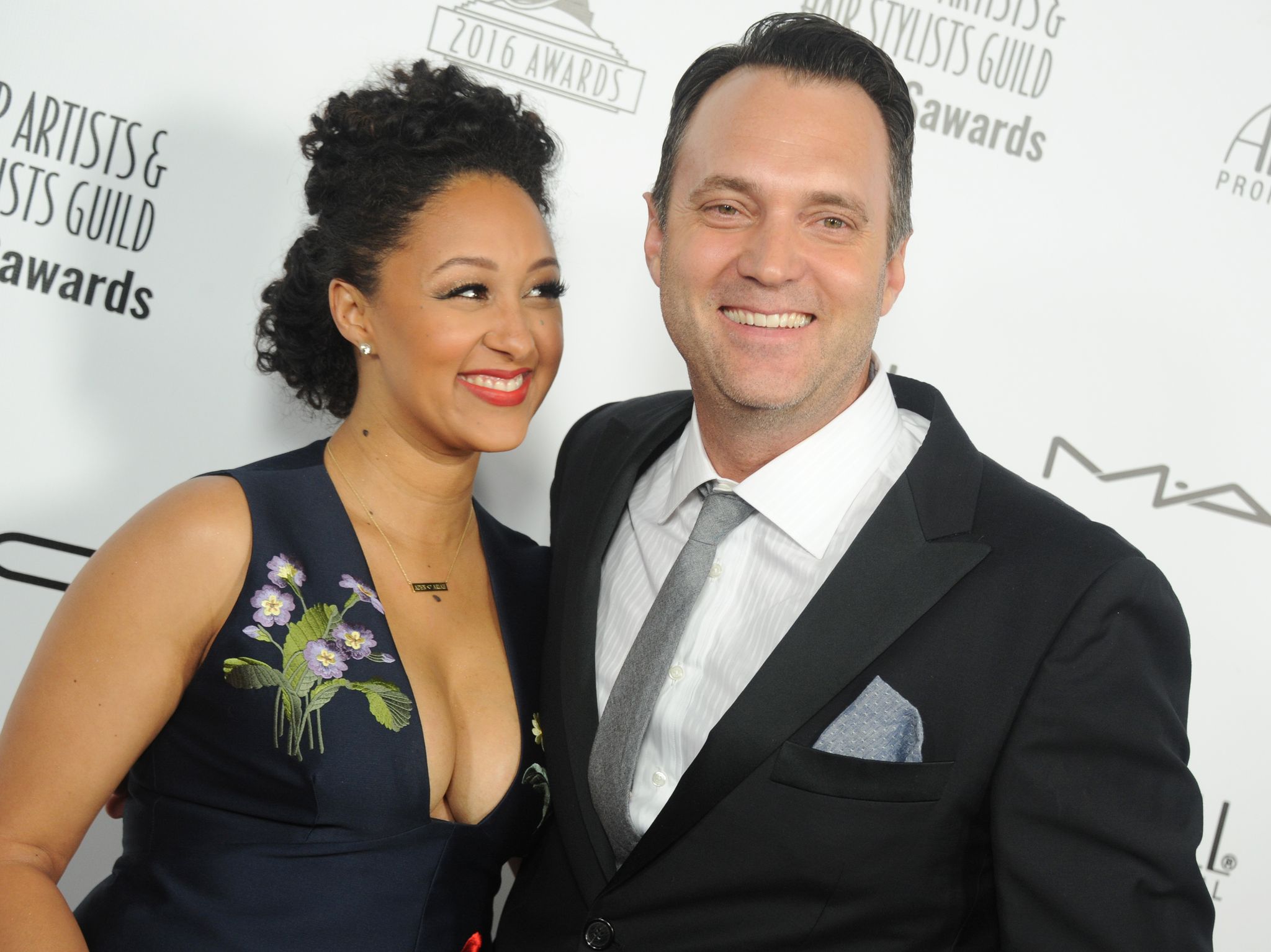 Tamera Mowry-Housley and Adam Housley arrive on the red carpet of the "Make-Up Artists and Hair Stylists Guild Awards" on February 20, 2016, in Hollywood, California | Source: Tibrina Hobson/Getty Images