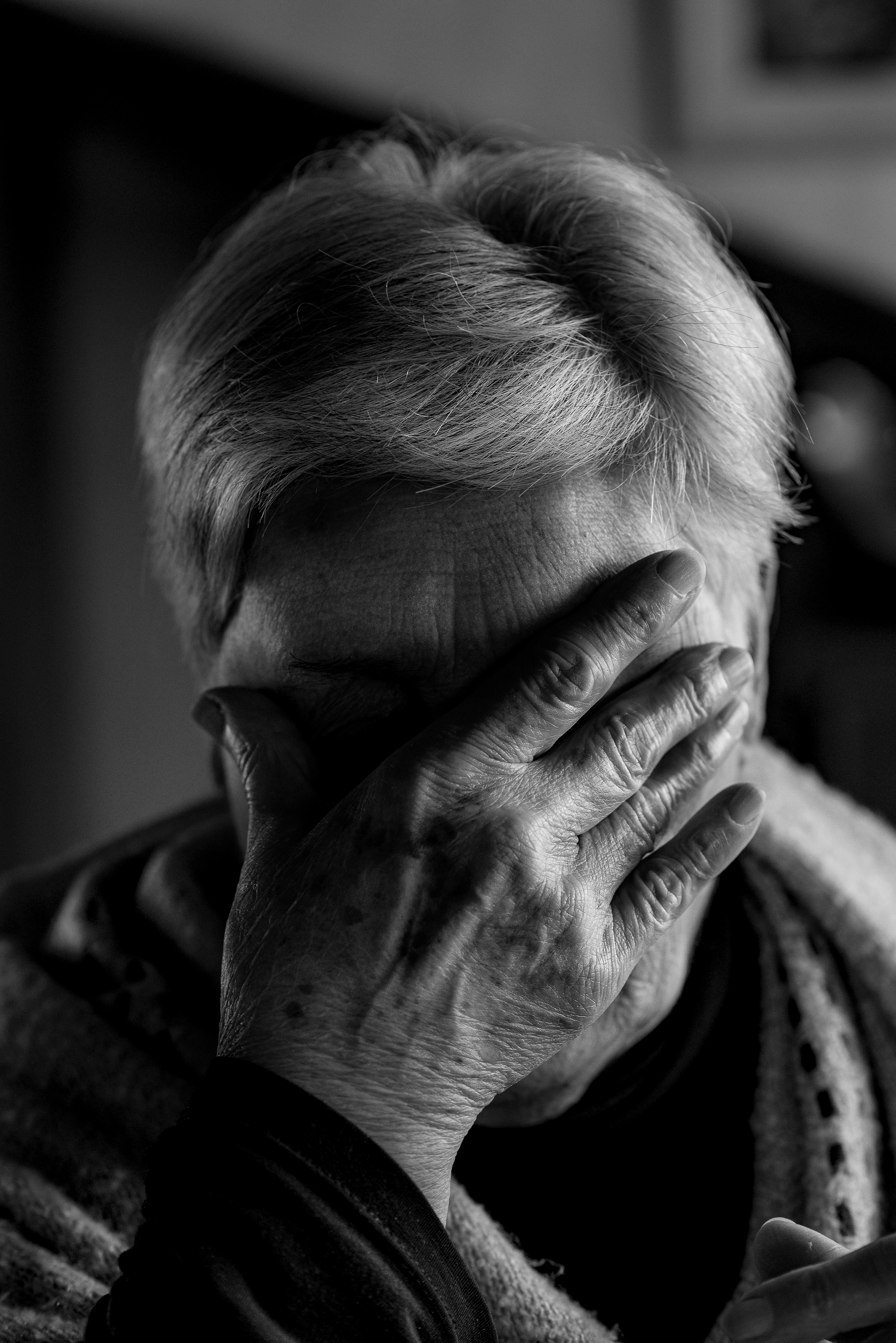 A woman covering her face with her hand | Source: Pexels