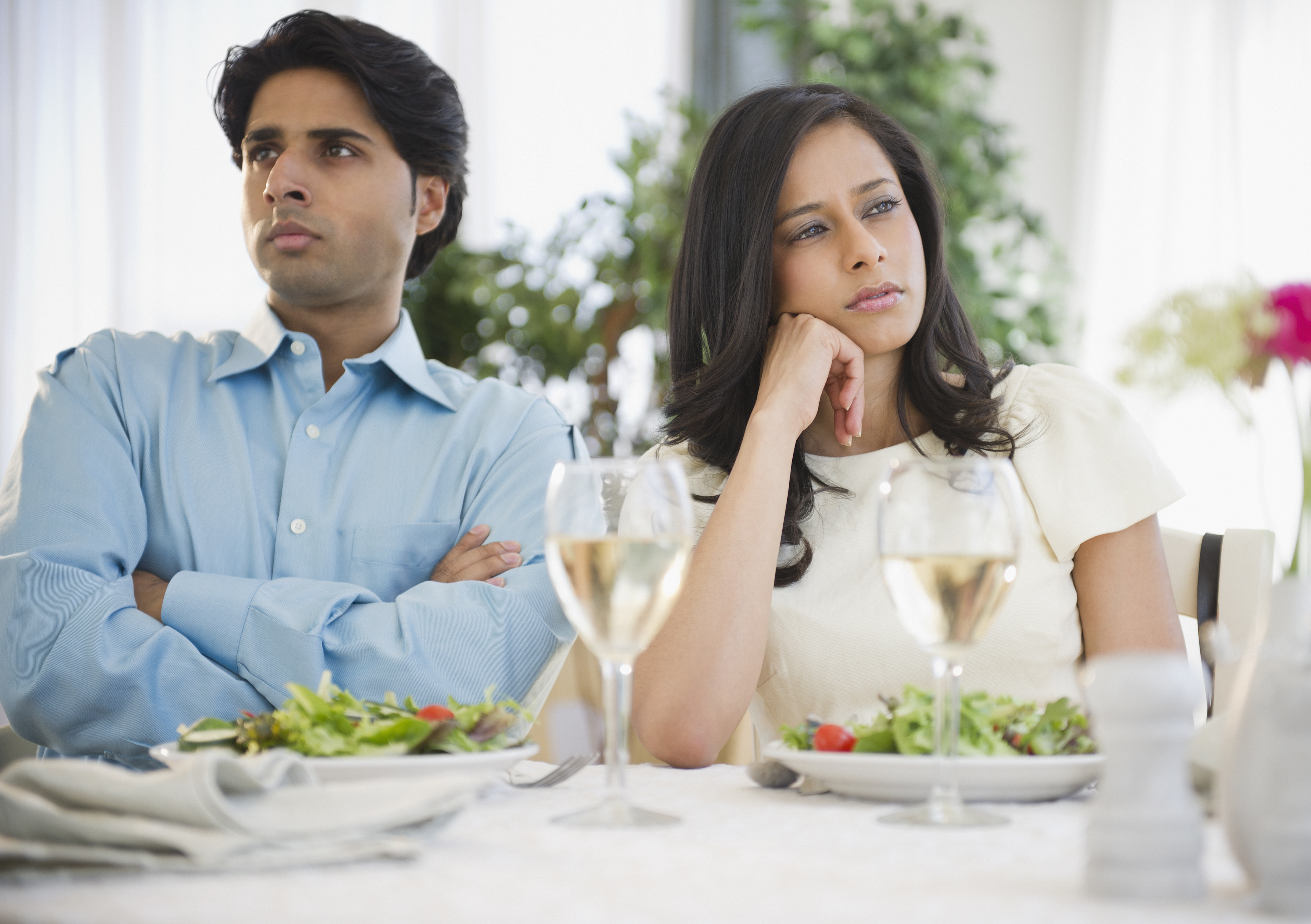 A man and woman not talking while sitting at a table | Source: Getty Images