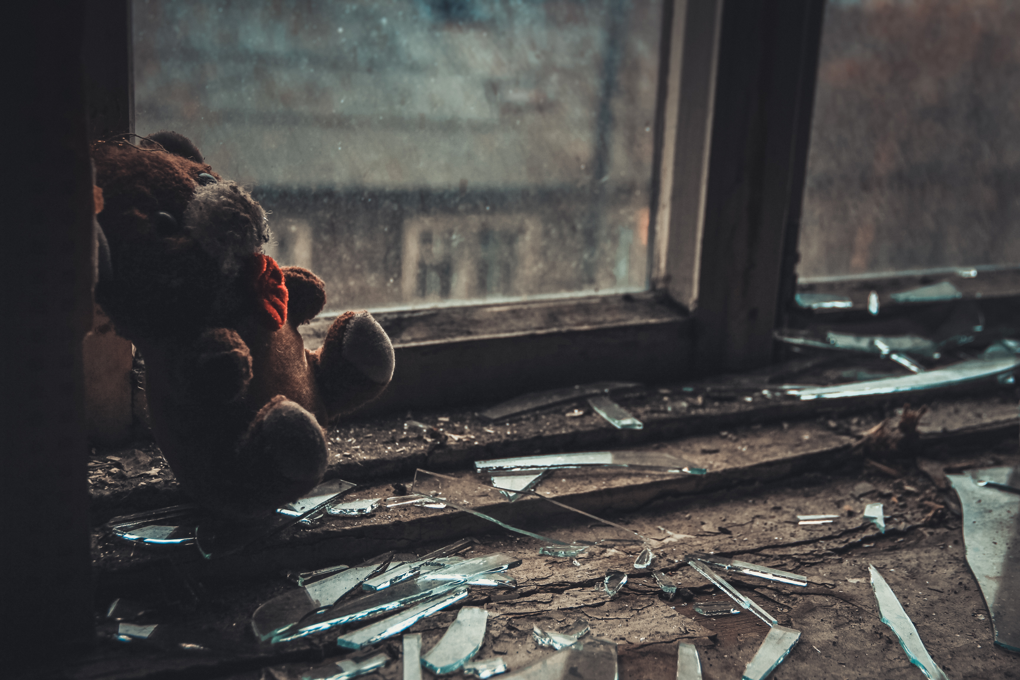 Soft toy on the windowsill in the empty abandoned apartment. | Source: Shutterstock