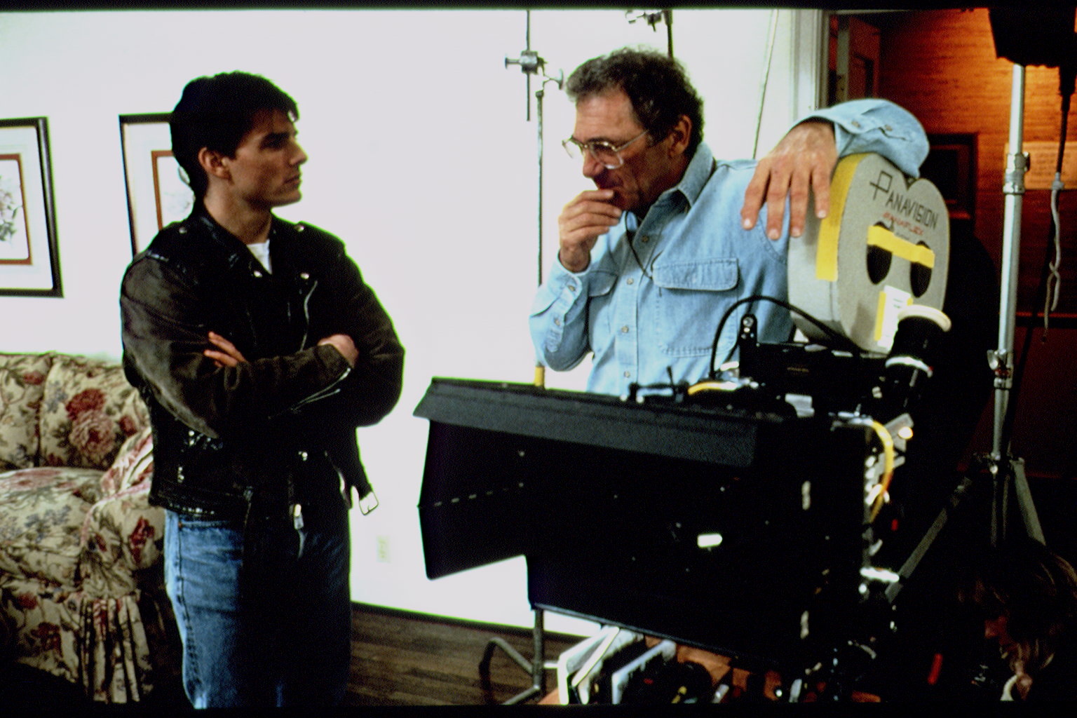 Tom Cruise with director Sydney Pollack on the set of the movie, "The Firm" in January 1993 | Source: Getty Images
