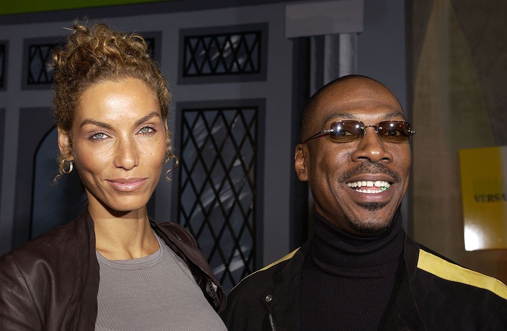 Eddie Murphy and wife Nicole Mitchell during DreamWorks' celebration of the DVD release of "Shrek 2" at Spago in Beverly Hills, California. I Photo: Getty Images.