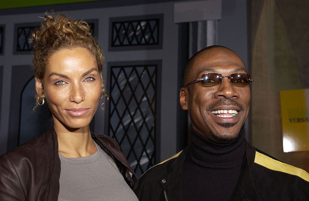 Eddie Murphy and wife Nicole Mitchell during DreamWorks' celebration of the DVD release of "Shrek 2" at Spago in Beverly Hills in November 2004. | Photo: Getty Images