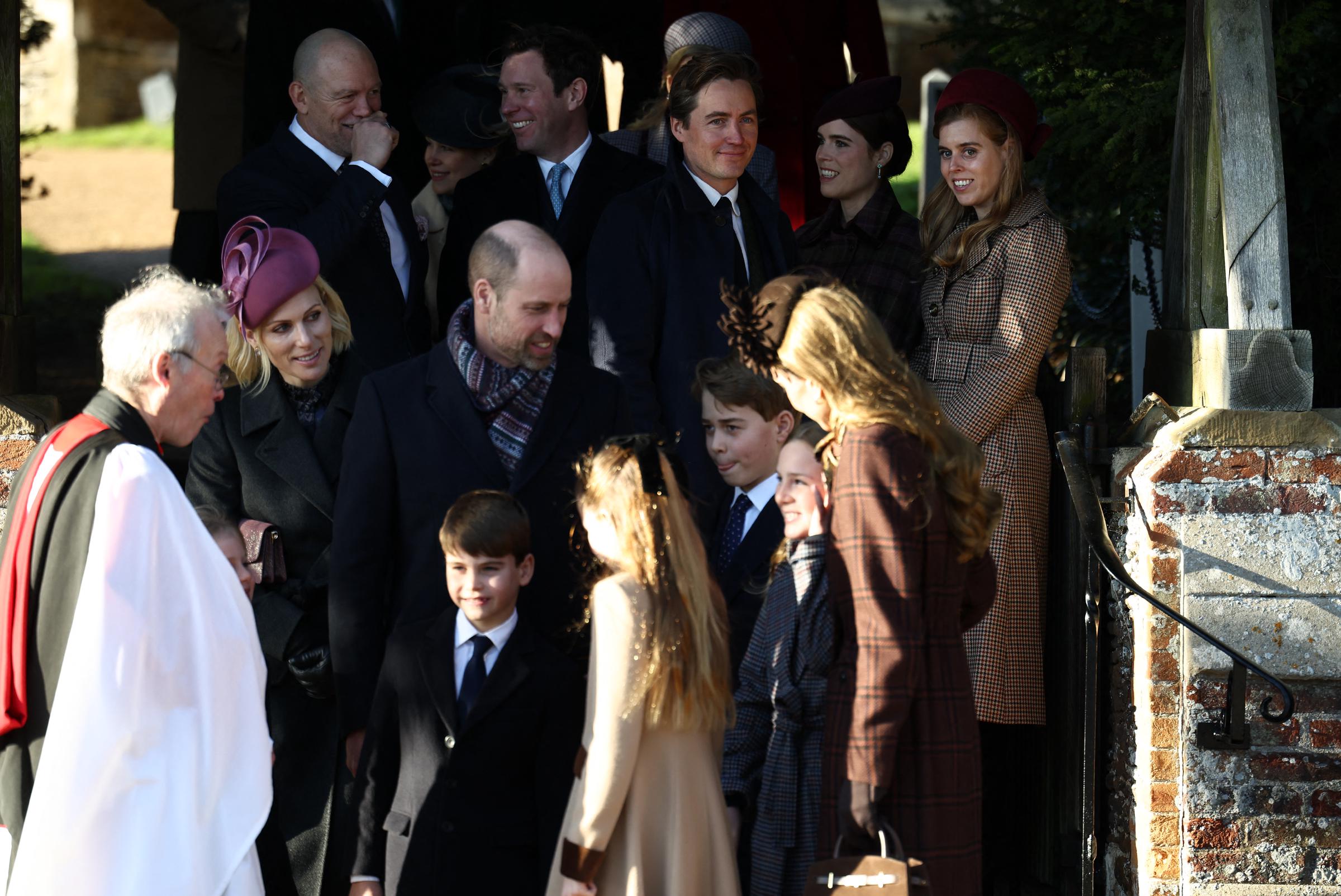 Members of the extended Royal Family gather on the church steps at Sandringham following the Christmas morning service, with Prince William positioned among relatives as conversations unfold. The closely watched appearance came as King Charles III sought to present unity amid ongoing scrutiny surrounding Andrew Mountbatten-Windsor.