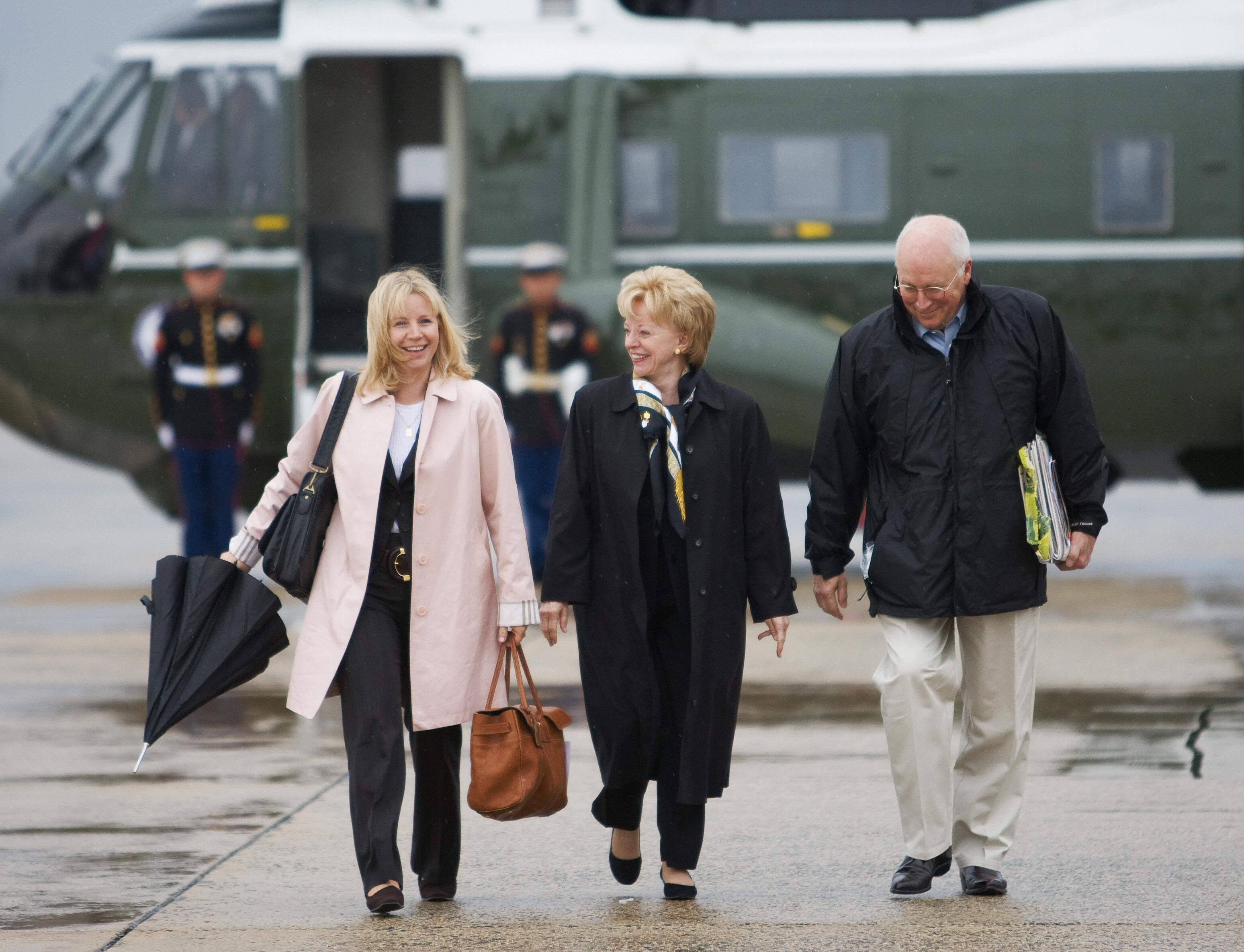 Dick Cheney walks with his daughter Liz and wife Lynne to board Air Force Two at Andrews Air Force Base for a Middle East trip on March 16, 2008 | Source: Getty Images