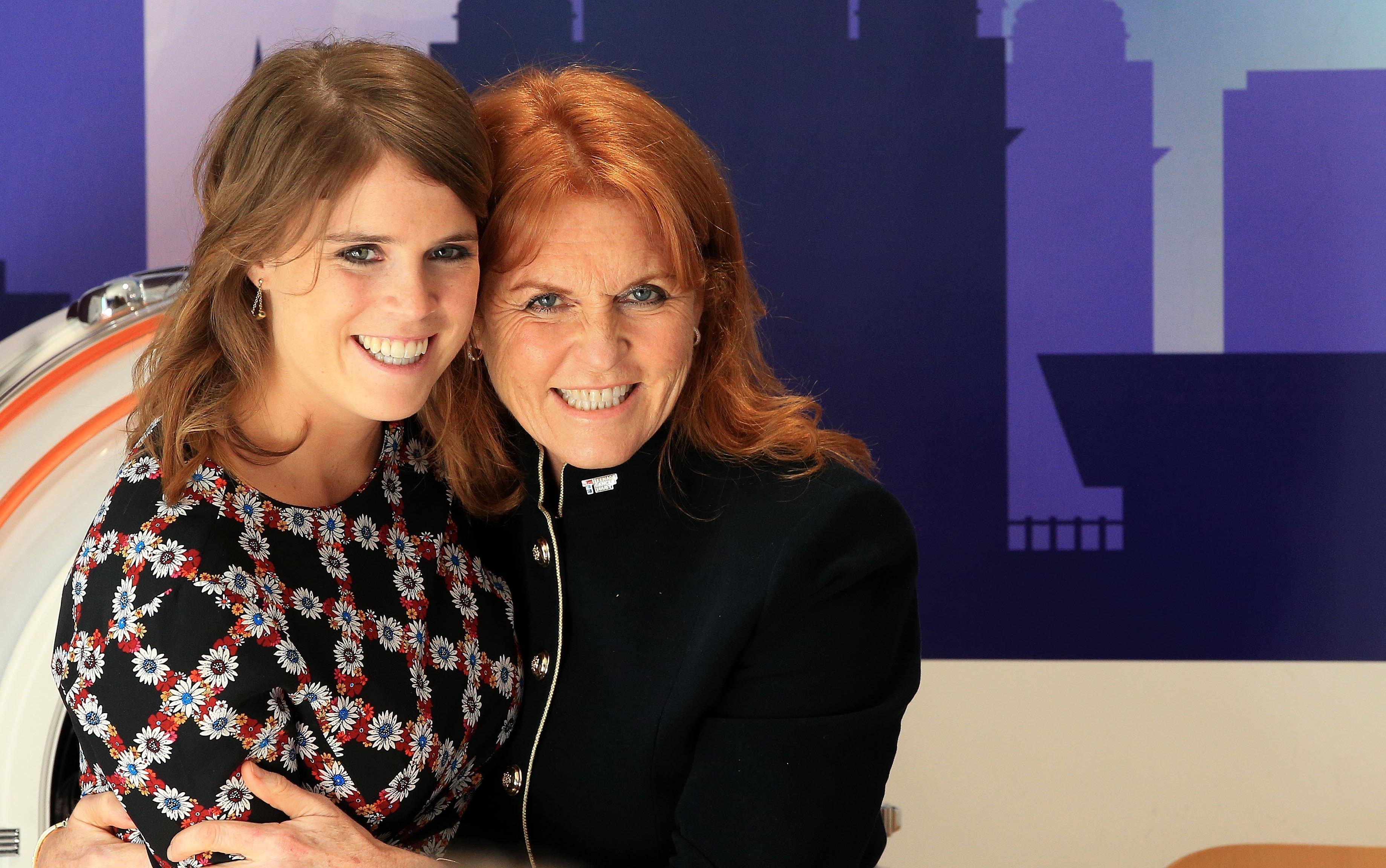 Sarah Ferguson and Princess Eugenie share a hug during a visit to the Teenage Cancer Trust ward at Alder Hey Hospital in Liverpool in September 2017. | Source: Getty Images