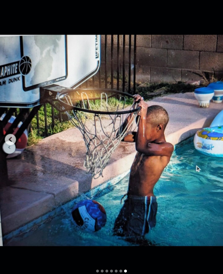 A young Brandon Clarke hangs from a poolside basketball hoop during a childhood swimming session. | Source: Instagram/brandon_clarke23