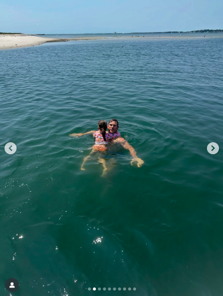 Chris Pratt swimming with one of his and Katherine Schwarzenegger's daughters, posted on August 23, 2025. | Source: Instagram/katherineschwarzenegger
