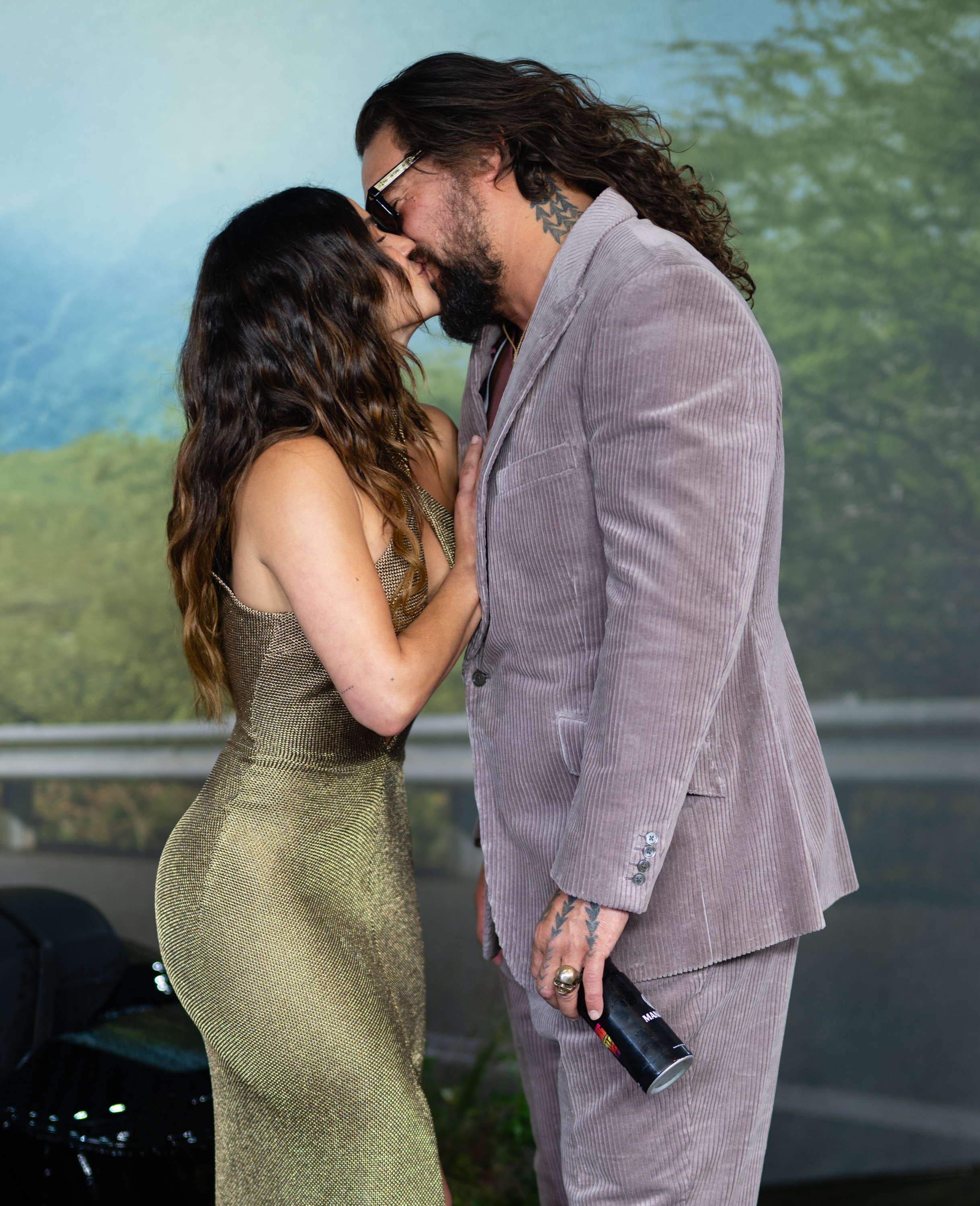 Jason Momoa and Adria Arjona share a kiss at a special screening of "The Wrecking Crew" in London's Leicester Square on January 22, 2026. Earlier that month, Momoa described the actress as "the love of my life" while speaking about their relationship. | Source: Getty Images
