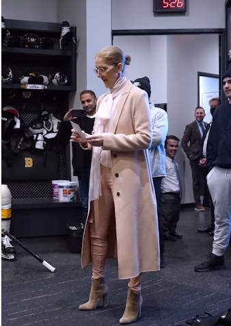 Celine Dion reading the lineup in the Bruins' locker room | Source: Instagram.com/nhlbruins
