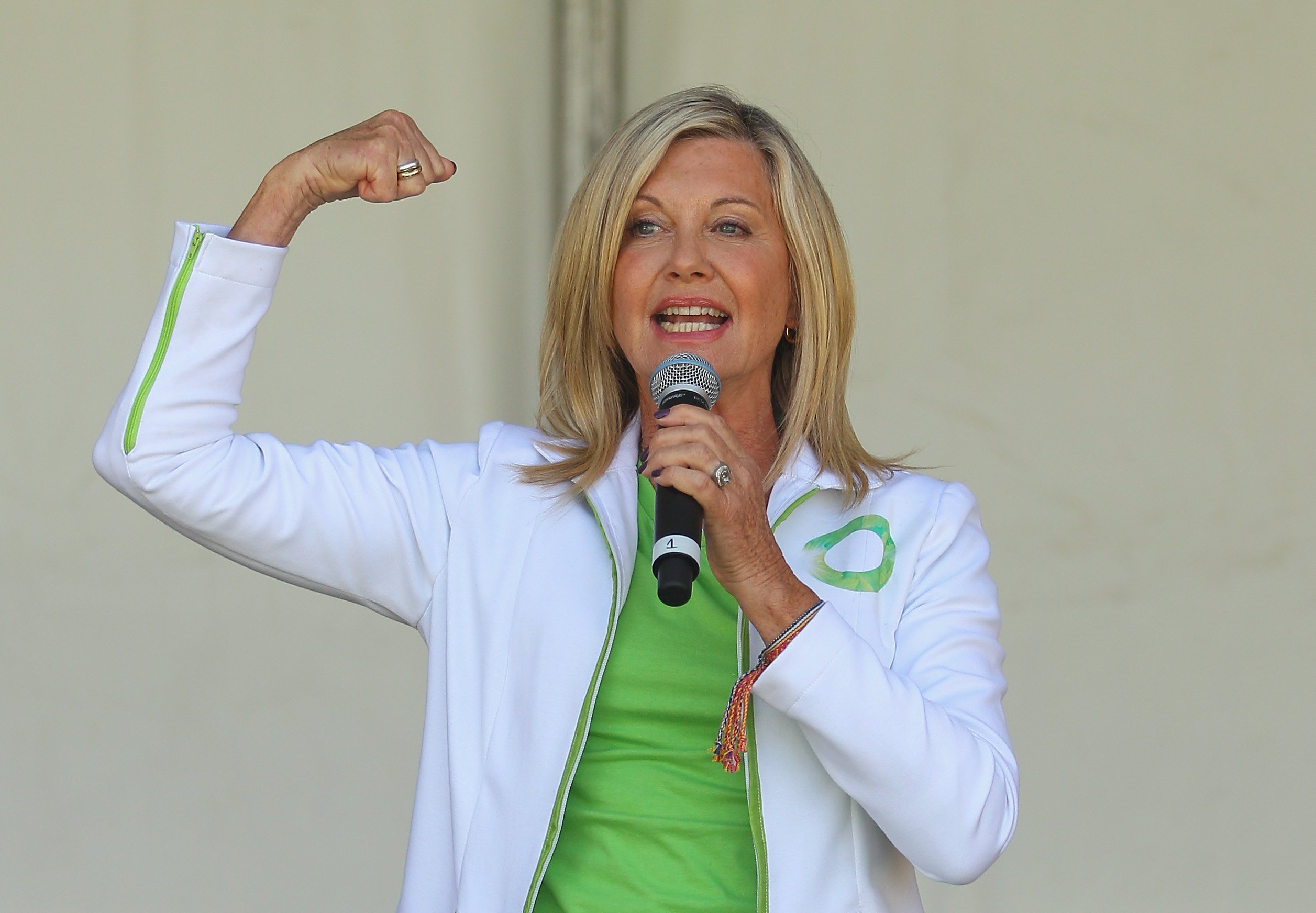 Olivia Newton-John performs her song "Physical" on stage before leading the inaugural Wellness Walk on September 15, 2013, in Melbourne, Australia. | Source: Getty Images