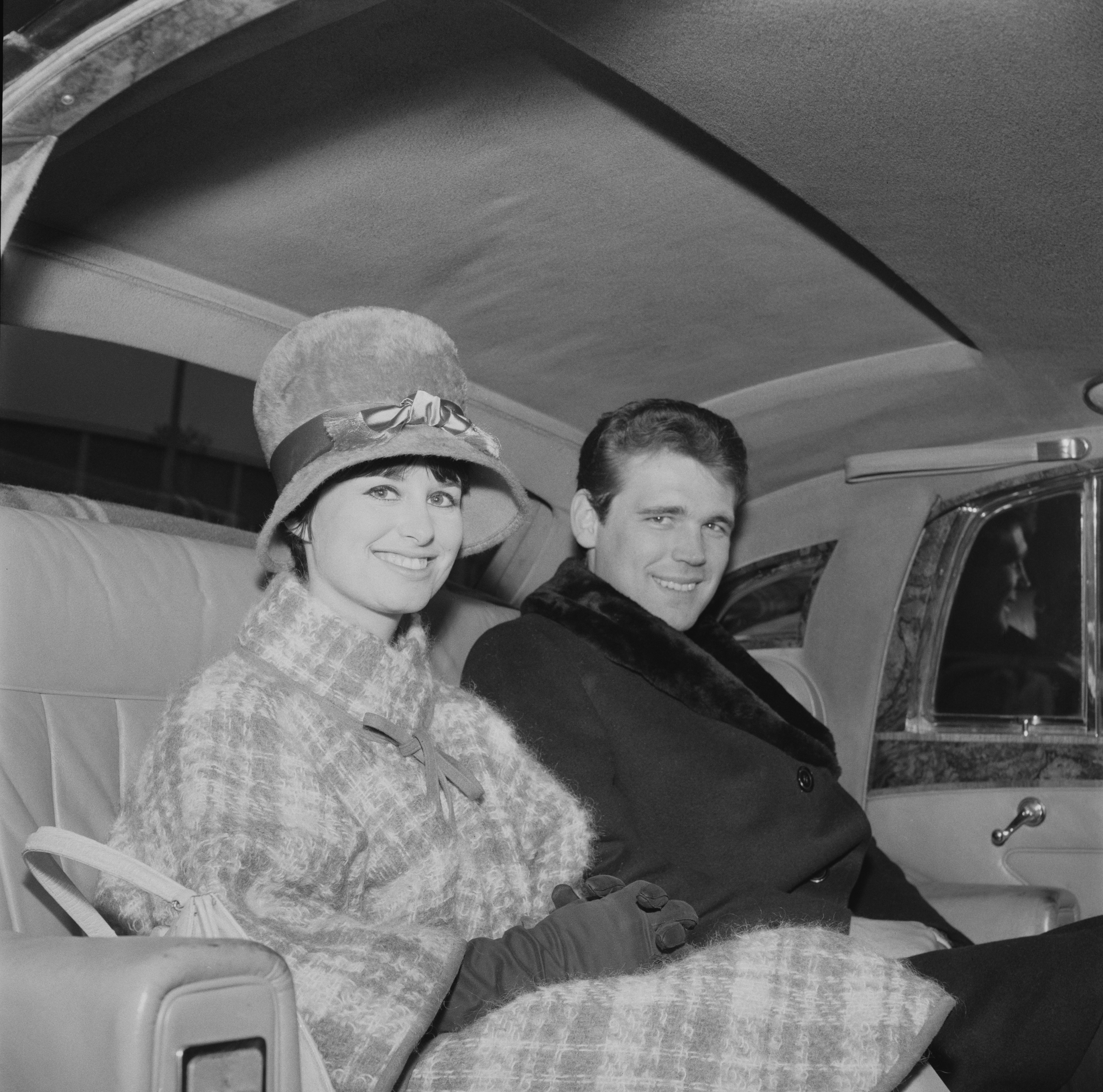 American guitarist Duane Eddy sitting in the back seats of a car with his wife Jessi Colter, UK, 11th November 1963 | Source: Getty Images 