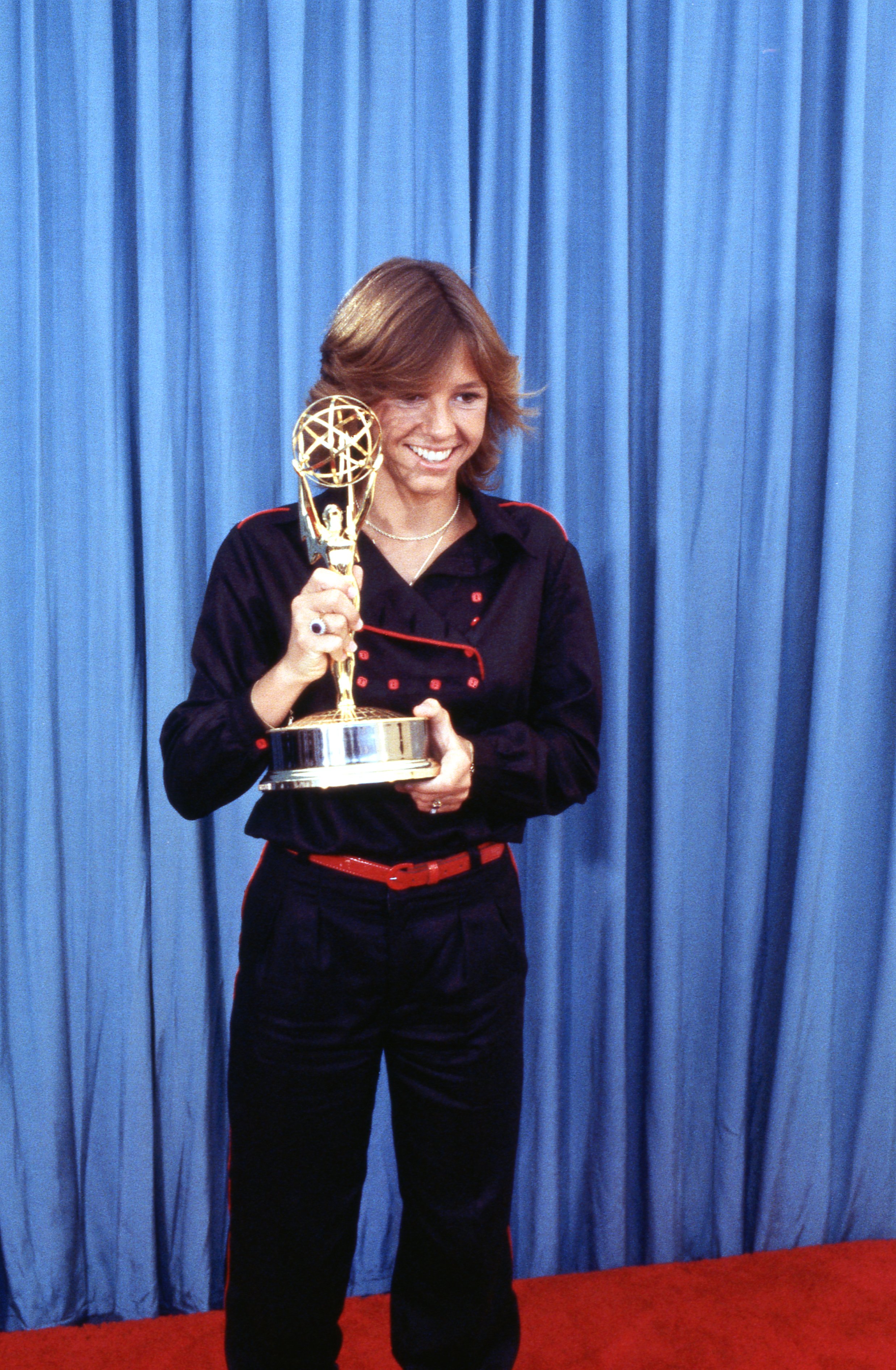 Kristy McNichol holding her Emmy Award in the press room at The 31st Annual Primetime Emmy Awards. | Source: Getty Images