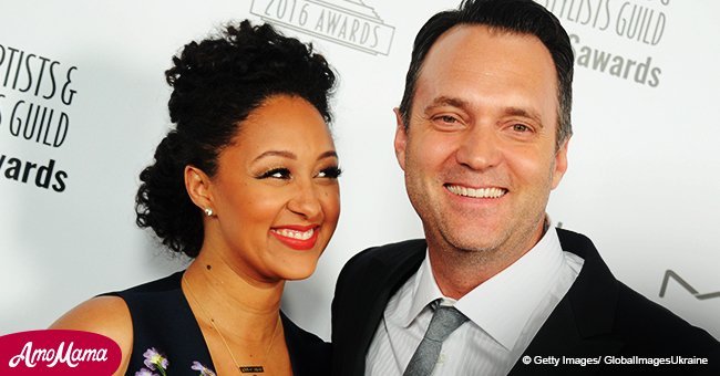 Tamera Mowry shares a cute photo of her hubby holding their two kids. He looks like a proud dad
