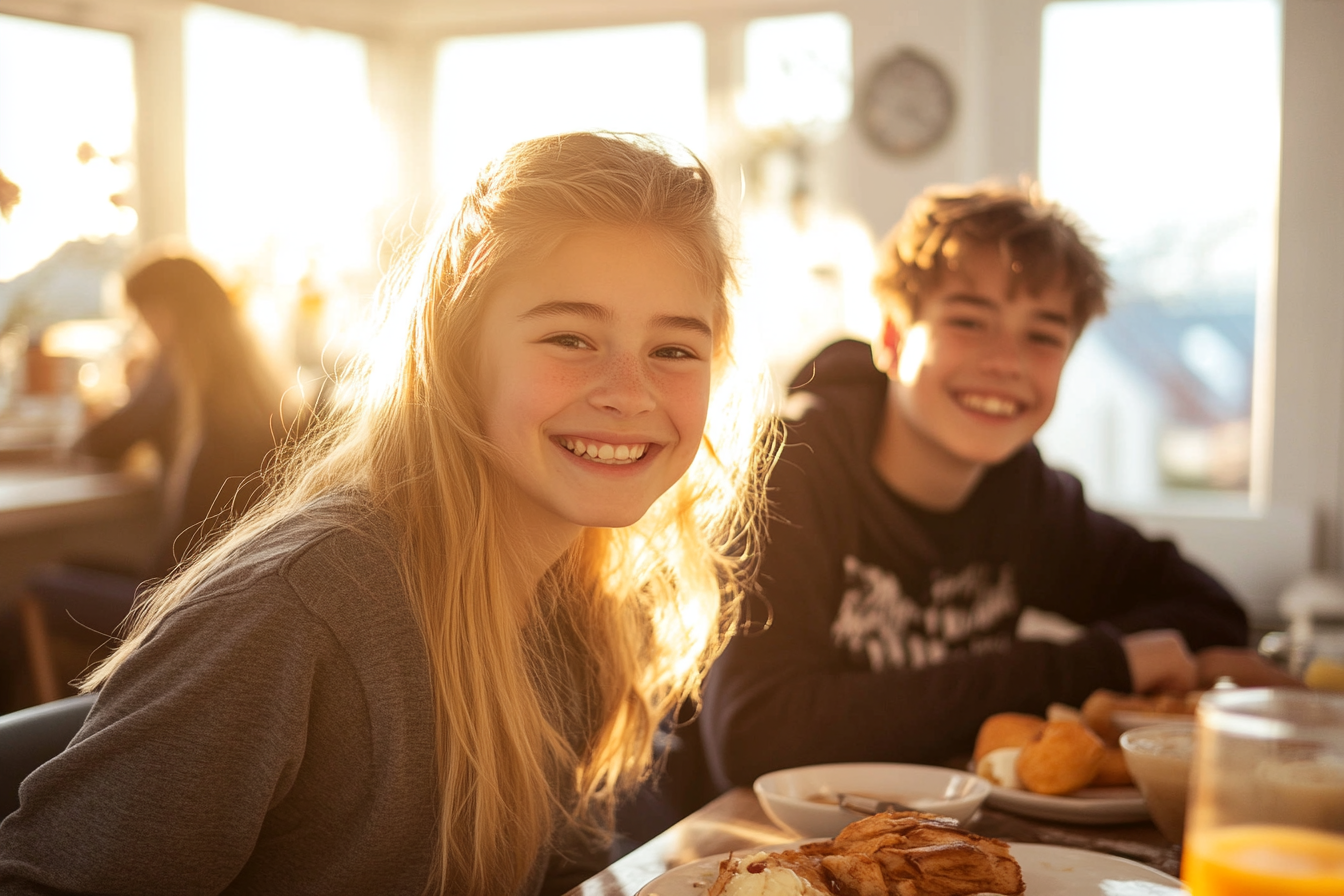 Teenagers sitting at a kitchen table | Source: Midjourney