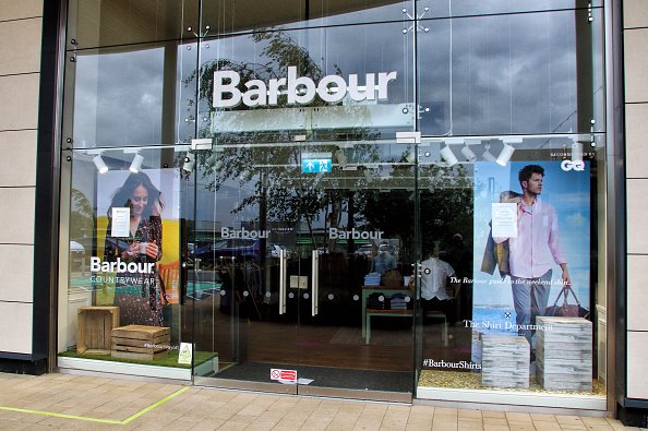 Barbour logo seen at one of their branches in United Kingdom. | Photo: Getty Images