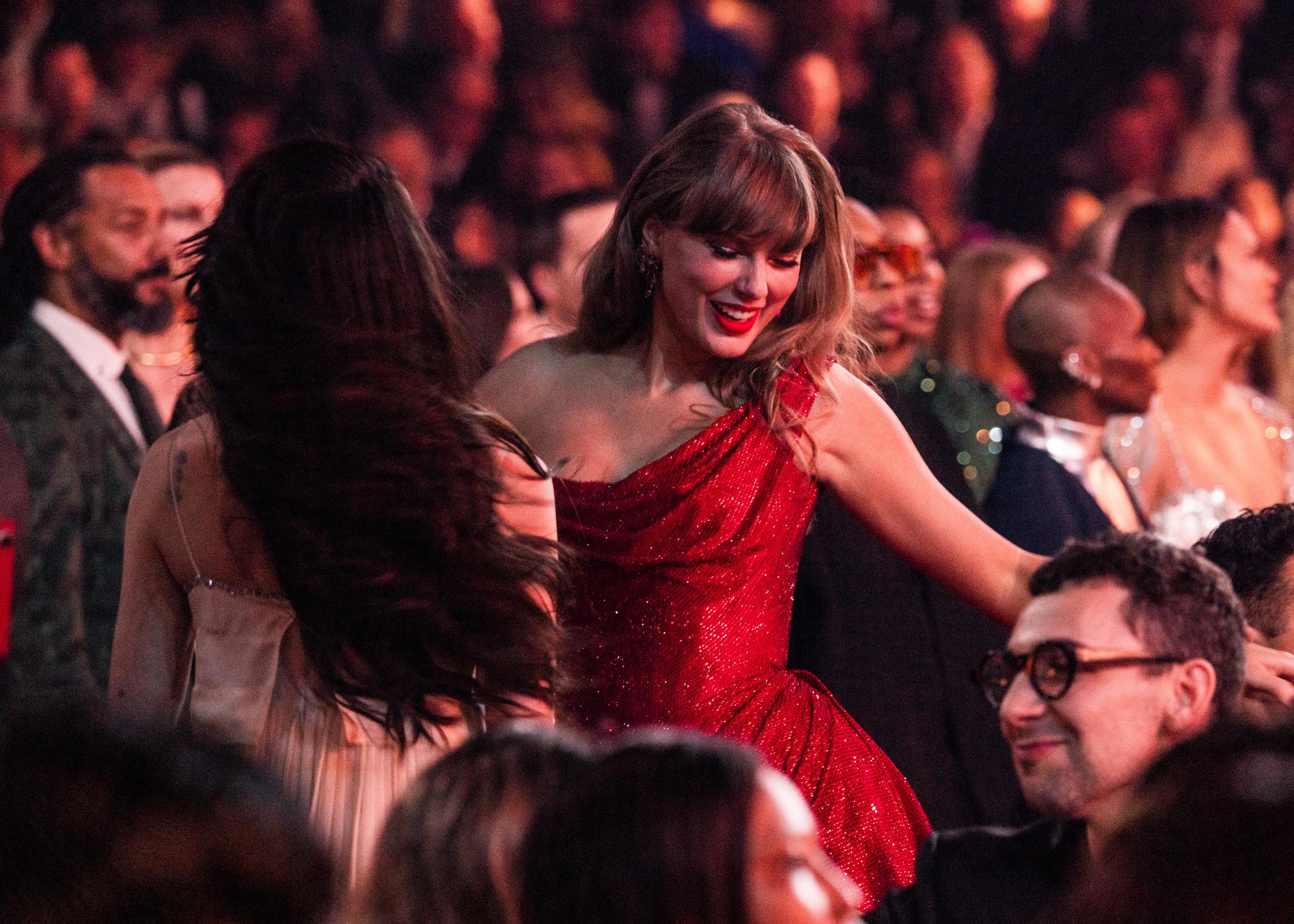 Taylor Swift enjoying herself at the 2025 Grammys. | Source: Getty Images