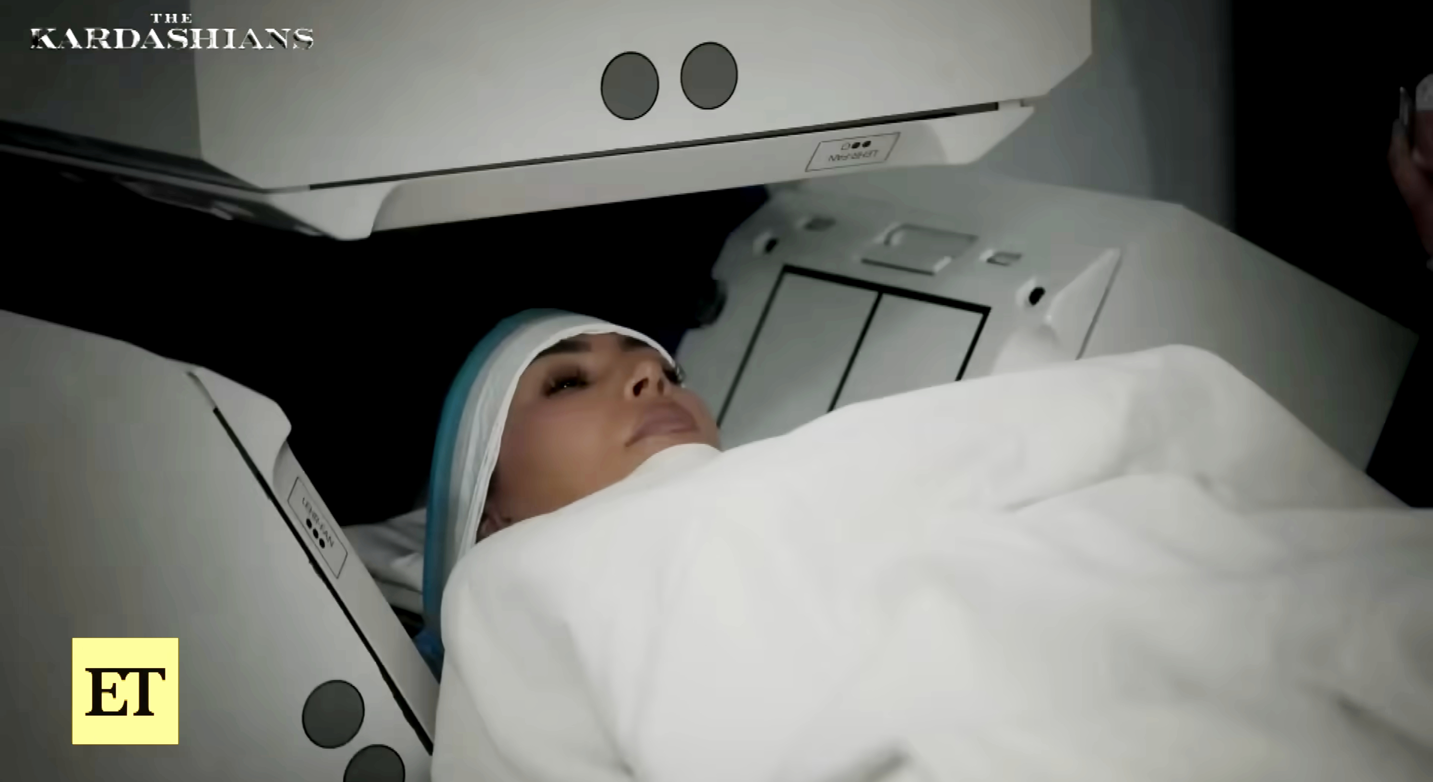 Kim Kardashian lies inside a medical scanner during a scene from "The Kardashians," as posted on October 24, 20255 | Source: YouTube/EntertainmentTonight