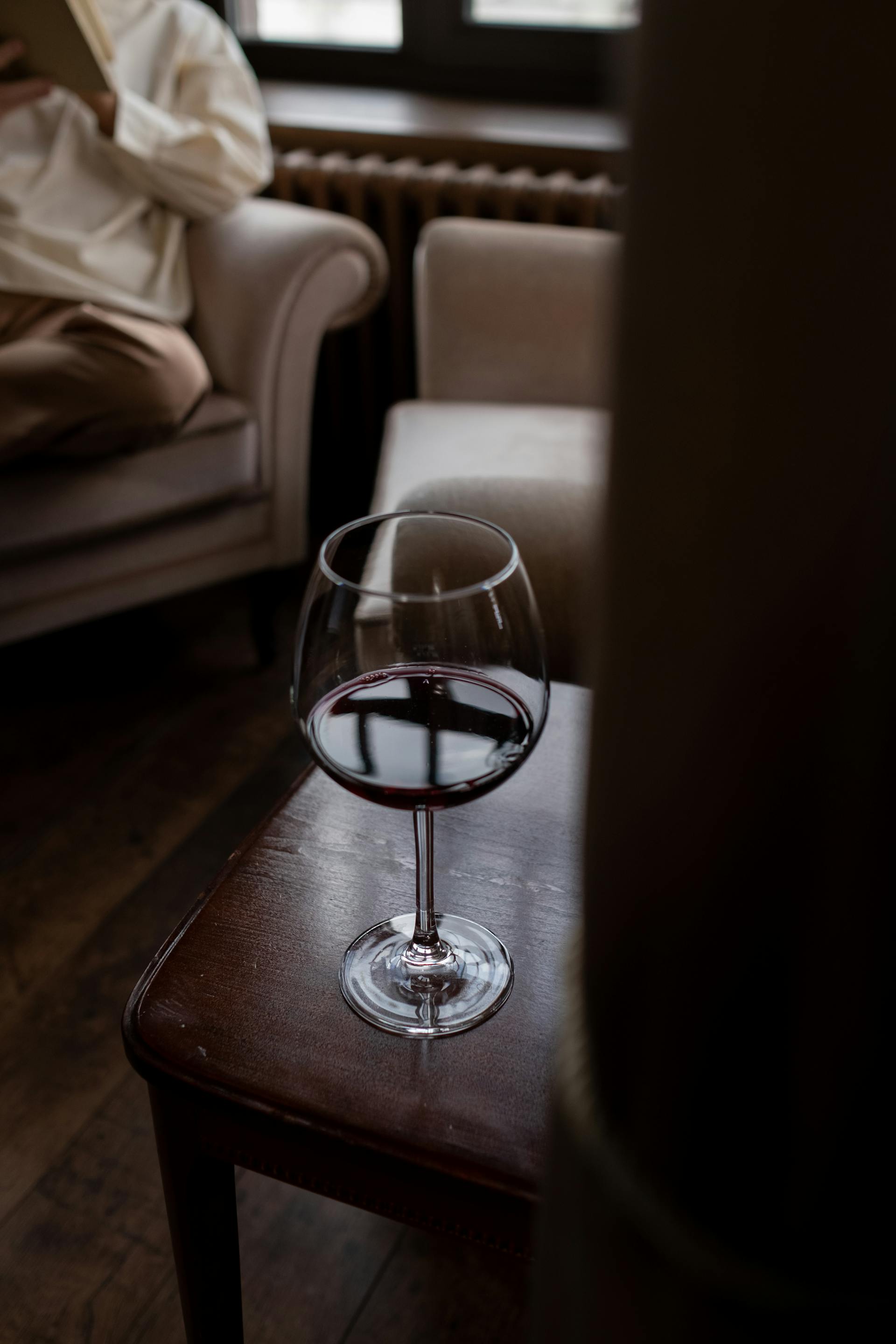 A glass of wine on a table | Source: Pexels