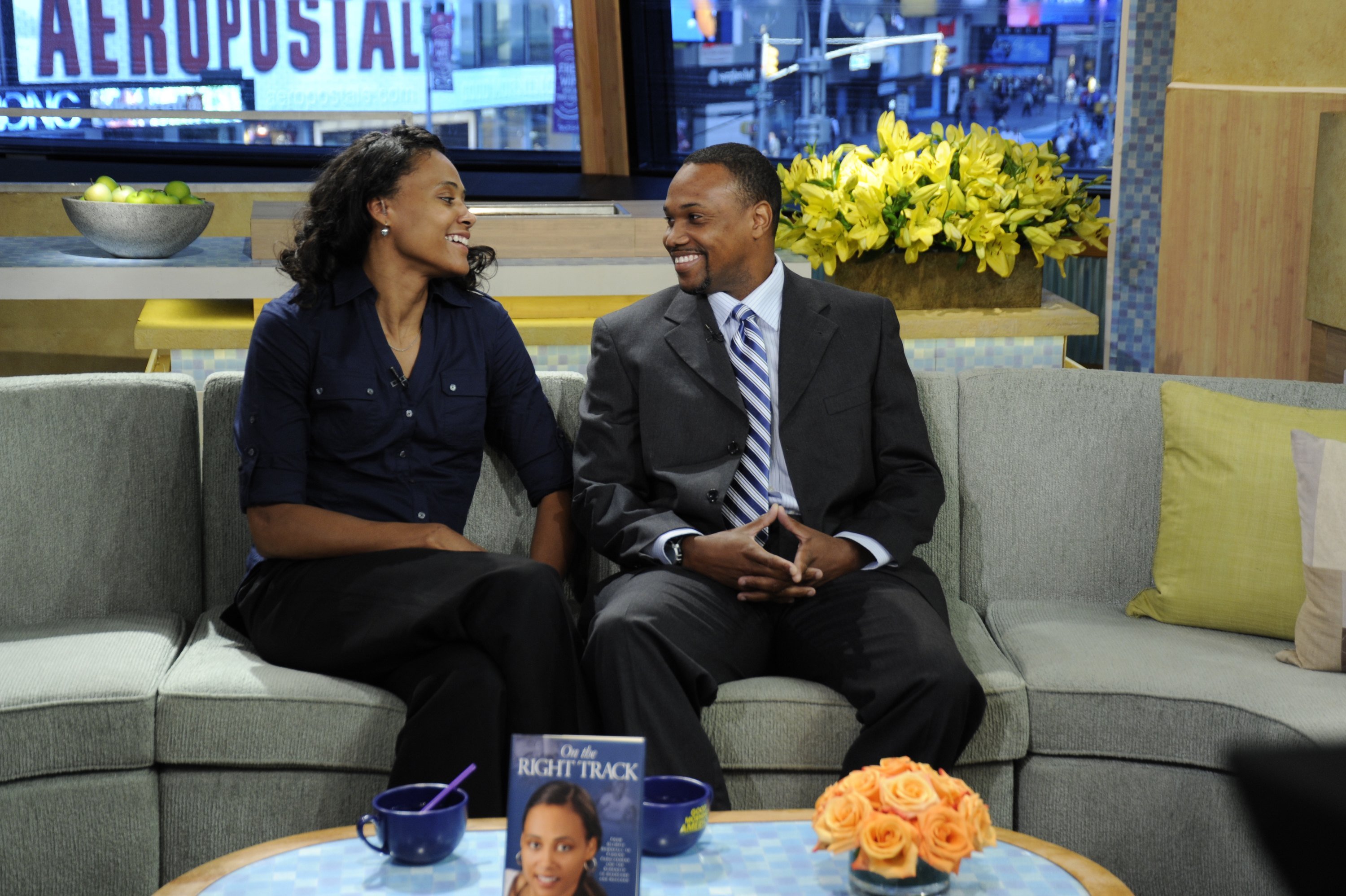 Marion Jones talks about her new book, "On the Right Track," with her husband Obadele Thompson on "Good Morning America" on October 26, 2010 | Photo: Donna Svennevik/Disney General Entertainment Content/Getty Images