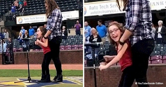 Girl, 7, with cerebral palsy starts singing the national anthem, and her voice moves the crowd