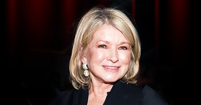 Martha Stewart Stacks Wine Glasses While Dining at a Restaurant in Photos