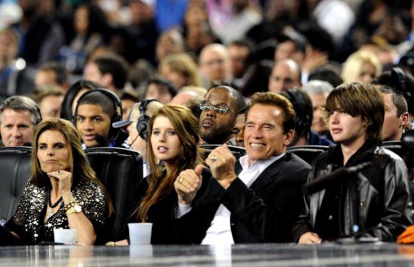 Maria Shriver, Christina Schwarzenegger, Governor of California Arnold Schwarzenegger and Patrick Schwarzenegger in the audience during the NBA All-Star Game held at Cowboys Stadium on February 14, 2010, in Arlington, Texas. | Source: Getty Images.