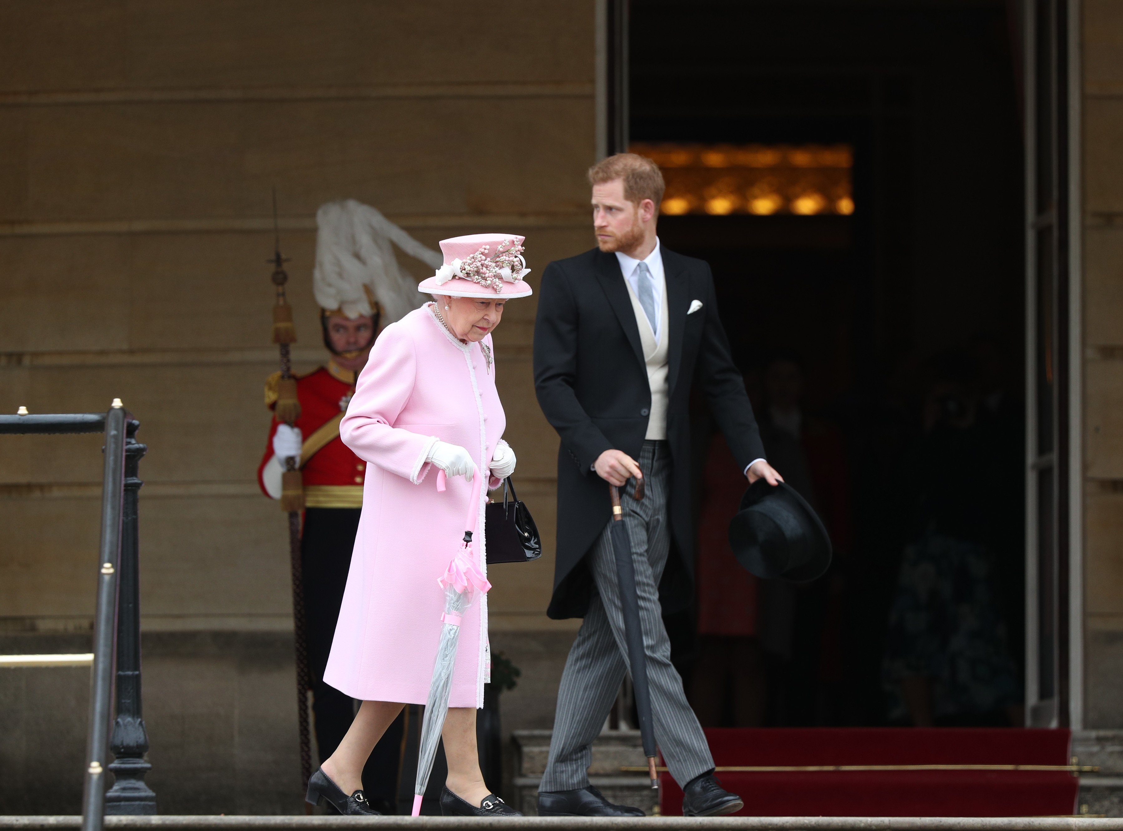 Queen Elizabeth II and Prince Harry, Duke of Sussex attend the Royal Garden Party at Buckingham Palace on May 29, 2019 in London, England | Source: Getty Images 