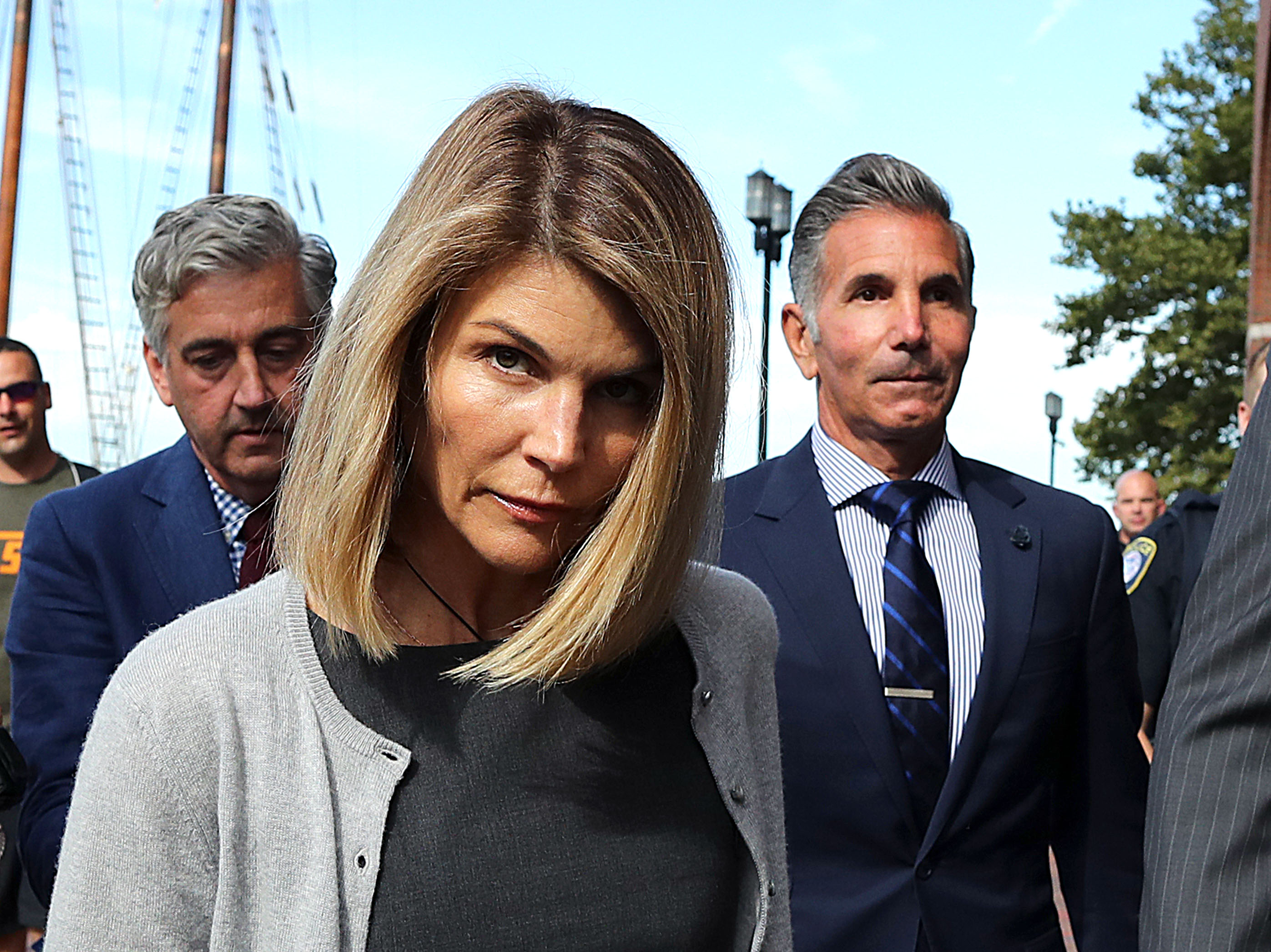 Lori Loughlin and her husband Mossimo Giannulli, right, leave the John Joseph Moakley United States Courthouse in Boston on August 27, 2019. | Source: Getty Images