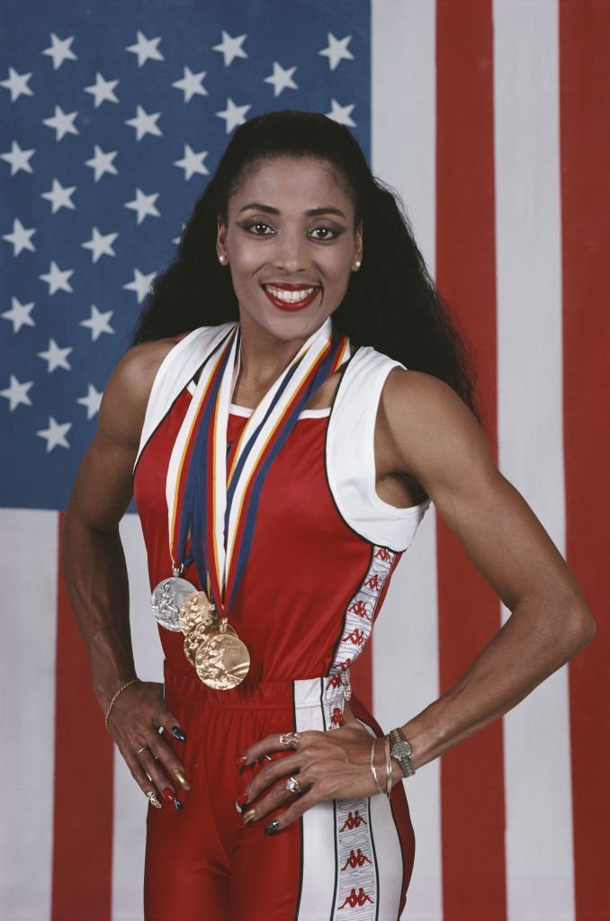 Athletes Florence Griffith-Joyner poses with her medals on September 25, 1988 at the Seoul Olympic Stadium in Seoul South Korea | Source: Getty Images 