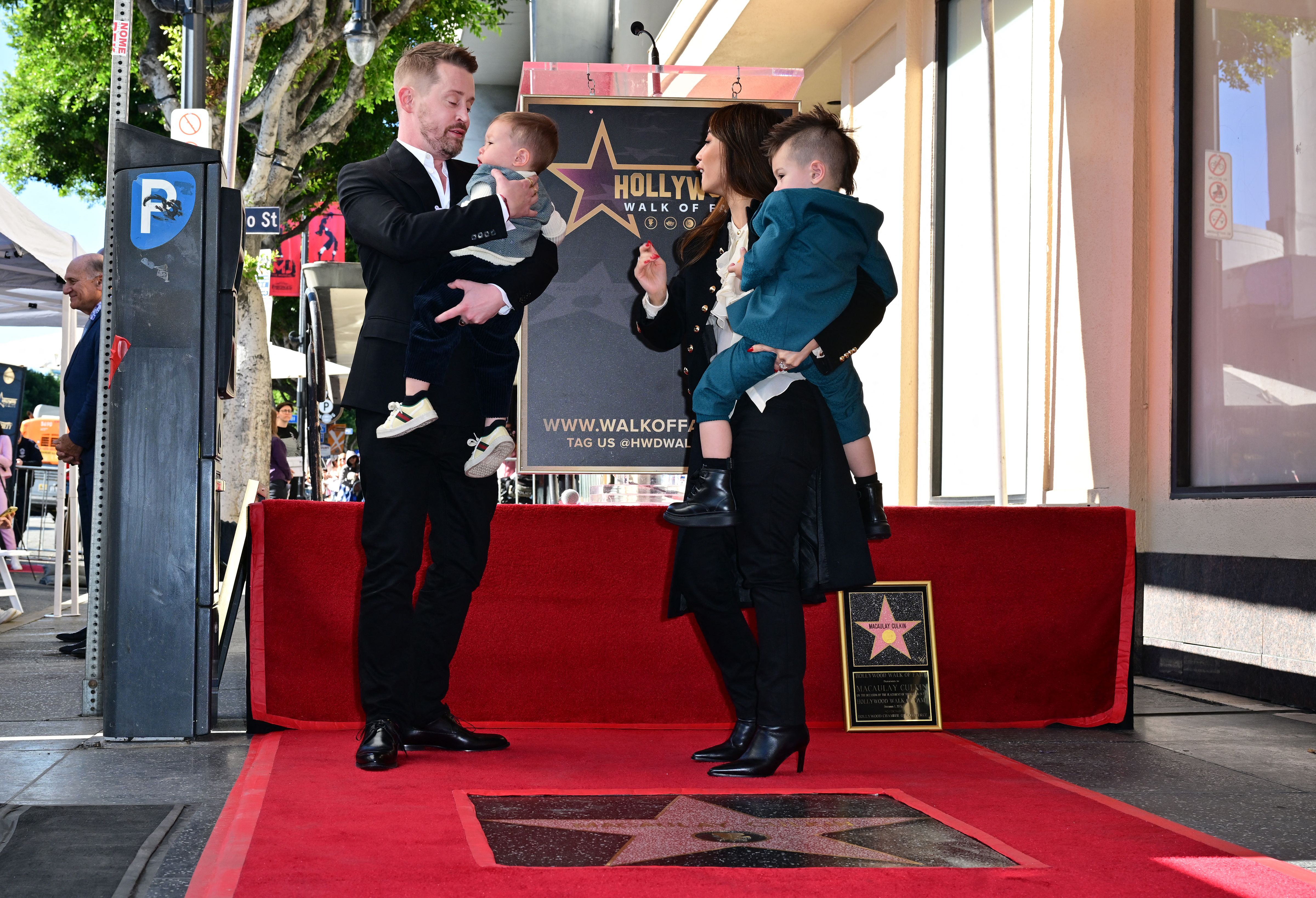 Macaulay Culkin, Brenda Song, Dakota Song Culkin, and the couple's younger son at the Hollywood Walk of Fame on December 1, 2023 in Los Angeles, California | Source: Getty Images