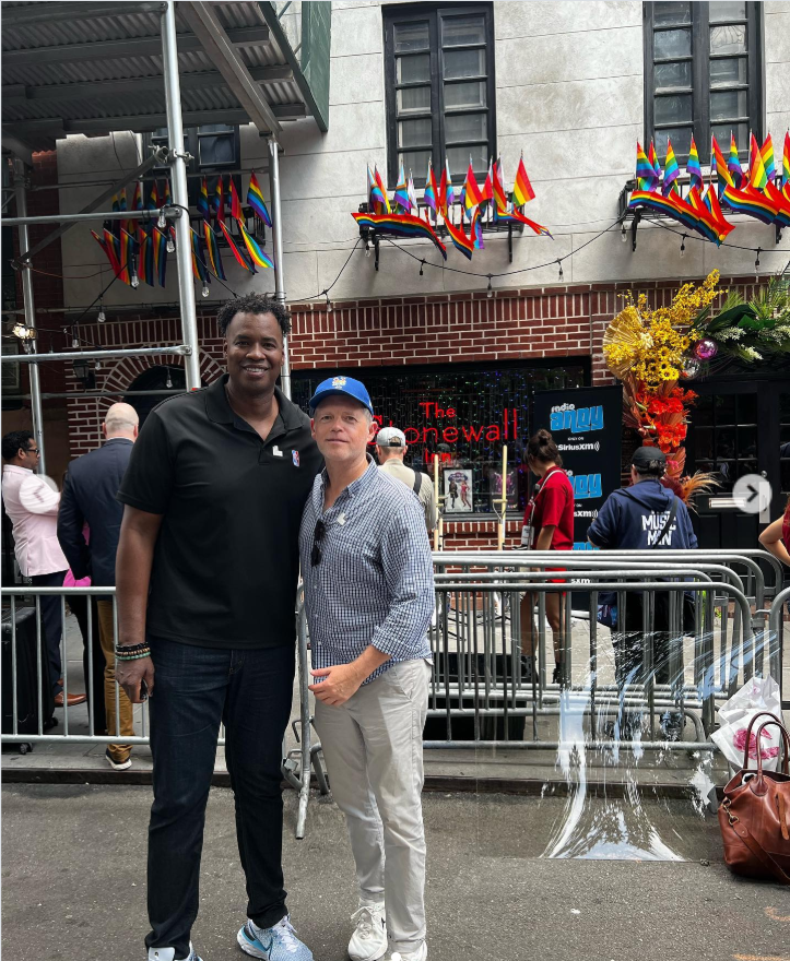 Jason Collins and his husband, Brunson Green, pose outside the historic Stonewall Inn surrounded by rainbow flags and Pride decorations during a public event in New York City. | Source: Instagram/jasoncollins_98