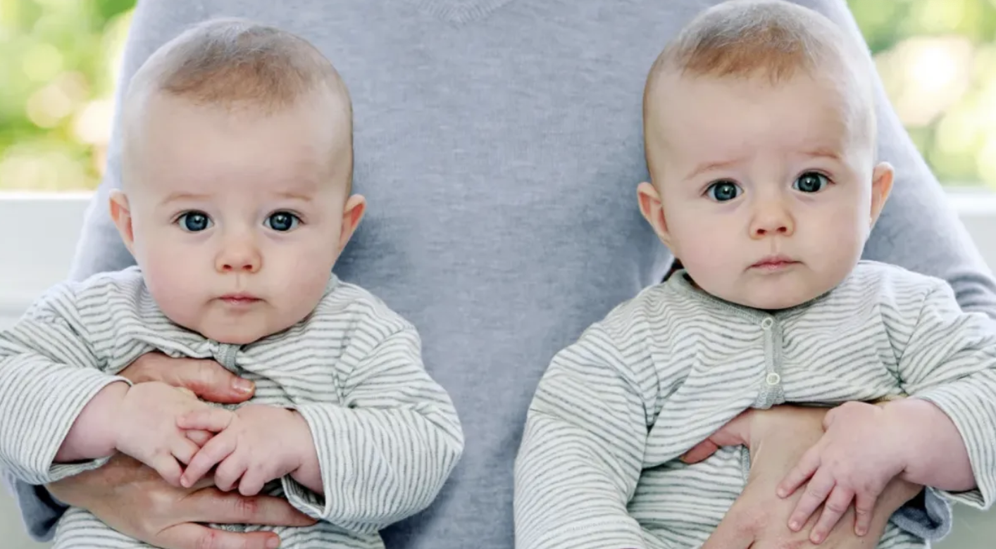 Man with two babies. | Source: Shutterstock