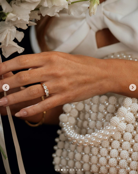 A close-up of Faye Harris' engagement ring and pearl handbag, posted on July 28, 2024 | Source: Instagram/fayeharriswood and tywoody1