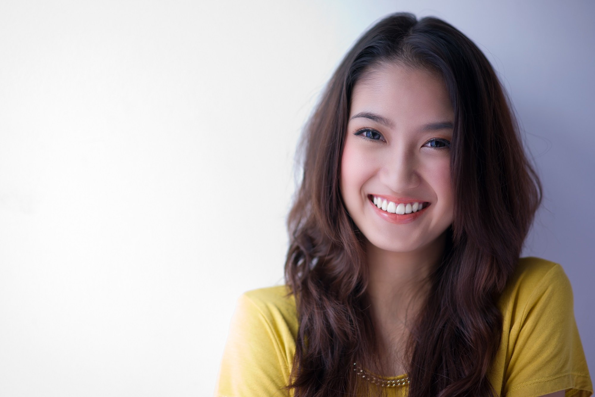 Mujer coreana sonriendo. | Foto: Shutterstock