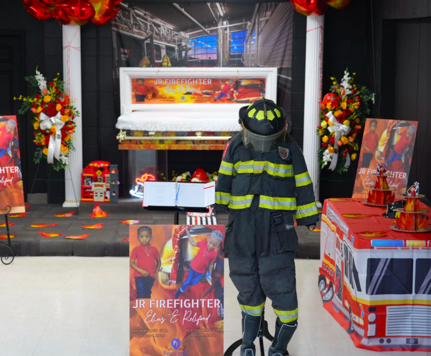 A view of the personalized firefighter items at Elias Reliford's funeral. | Source: Facebook/Fam First