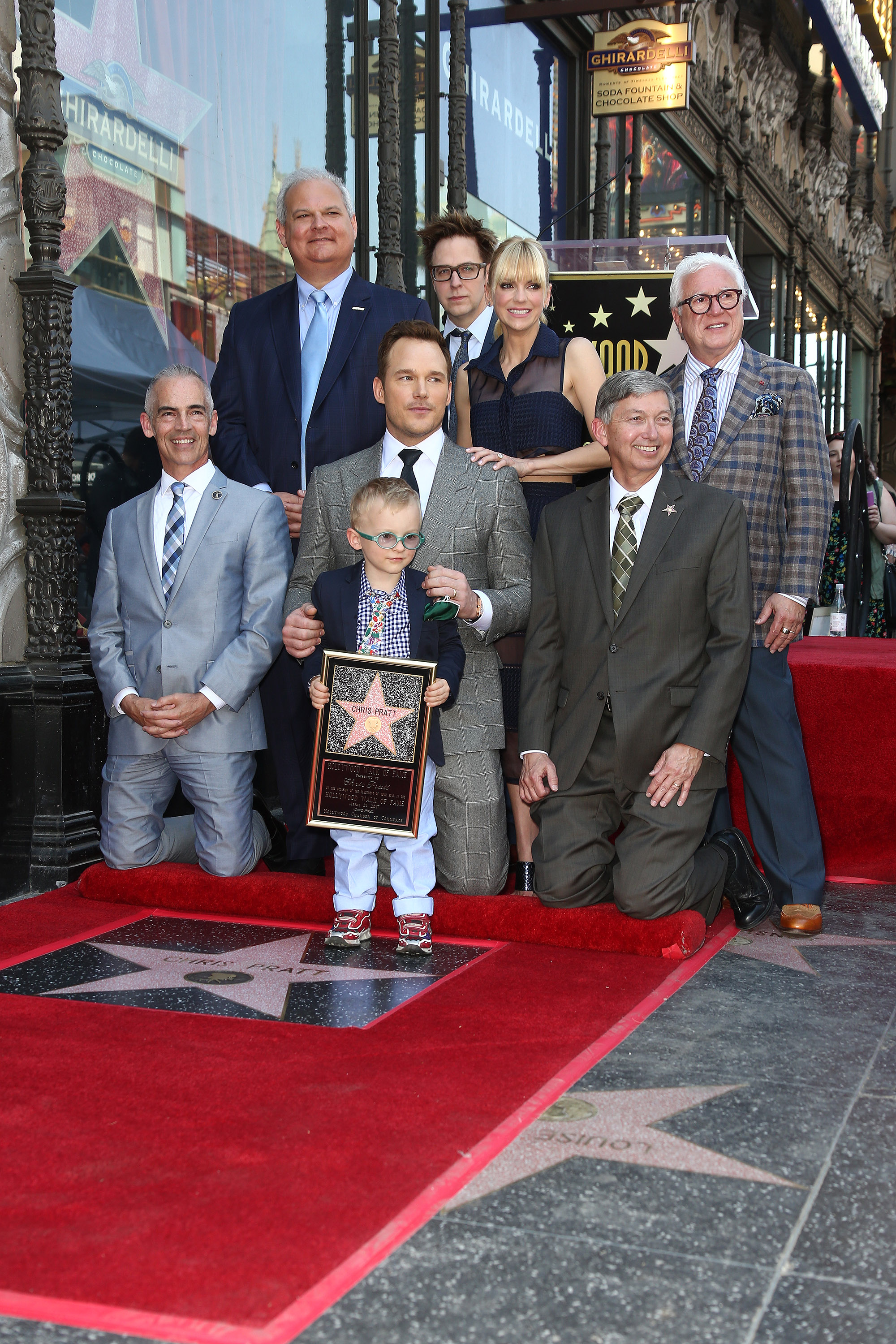 Anna Faris and Chris Pratt are joined by Jack Pratt, Mitch O'Farrell, James Gunn, and Leron Gubler during the Hollywood Walk of Fame celebration. The group gathered for a commemorative photo as family, friends, and colleagues honored the actor's accomplishments.