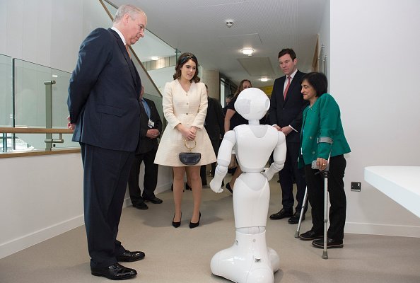 Prince Andrew, Princess Eugenie, Jack Brooksbank, and Dr. Saroj Patel with a robot called Pepper, during a visit to the Royal National Orthopaedic Hospital on March 21, 2019, in Stanmore, Greater London.| Source: Getty Images