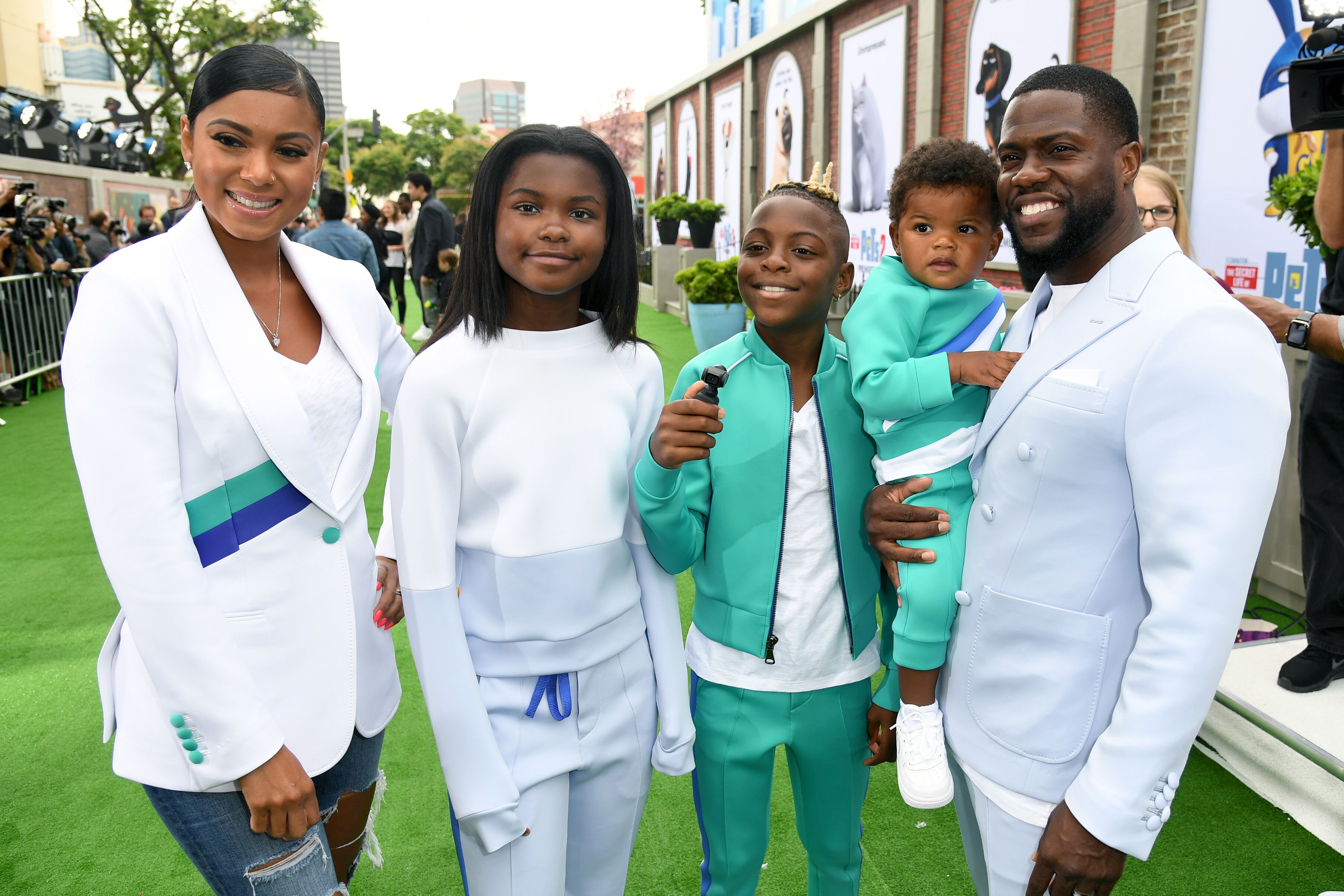 Kevin Hart and family in coordinated outfits during a public event. | Source: Getty Images/GlobalImagesUkraine