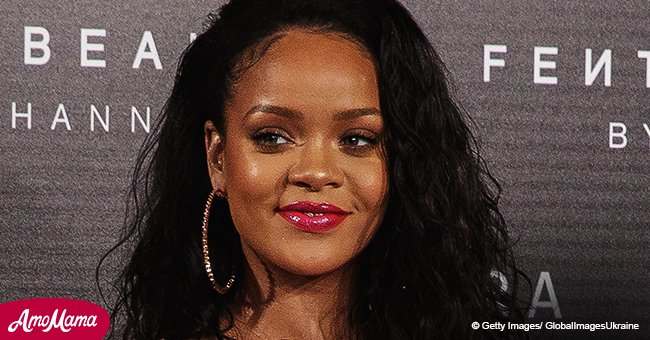 Rihanna, 30, nearly bares her cleavage as she goes braless in a zipped down pink outfit