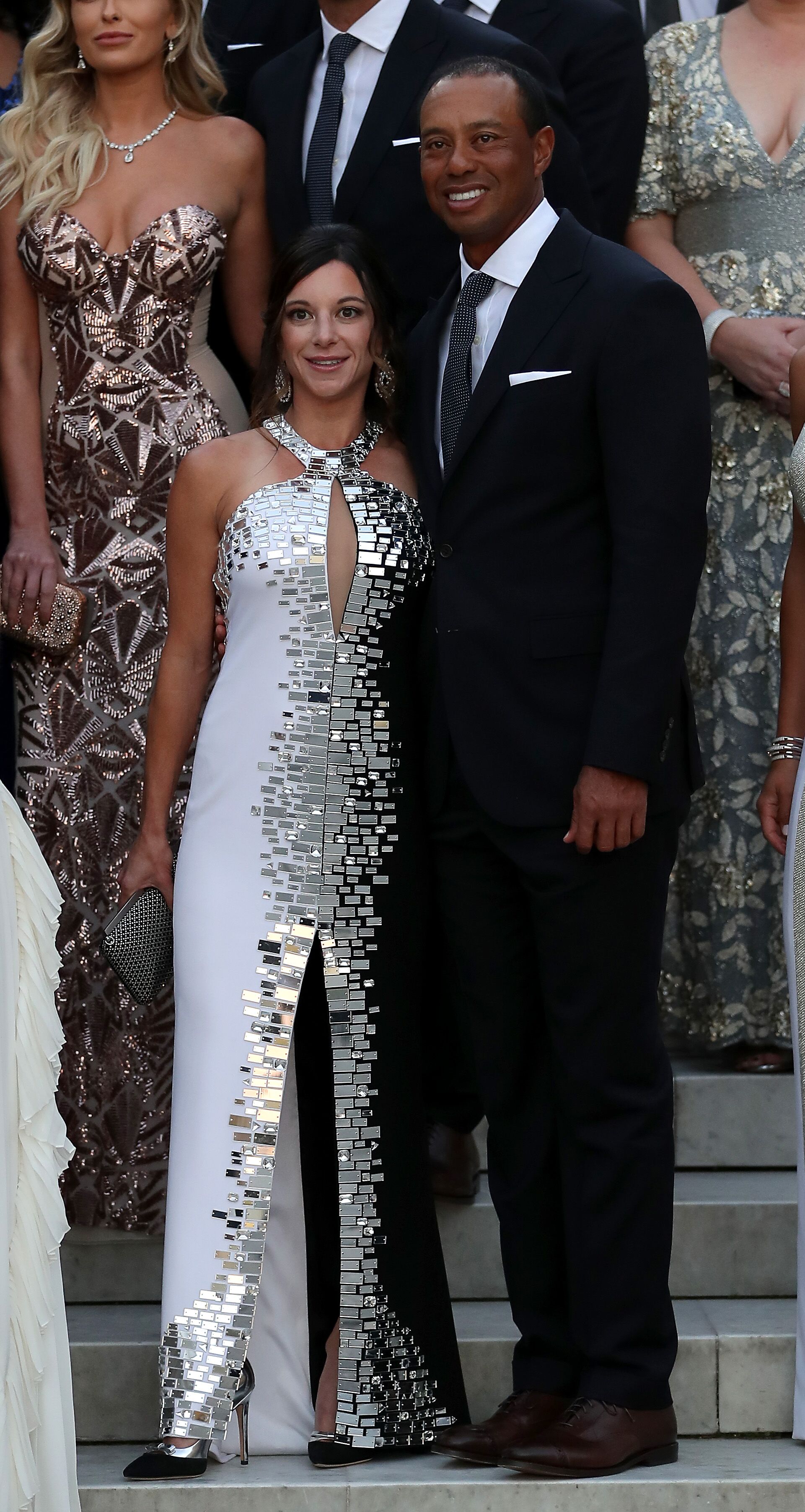  Tiger Woods poses with girlfriend Erica Herman before the Ryder Cup gala dinner. | Source: Getty Images