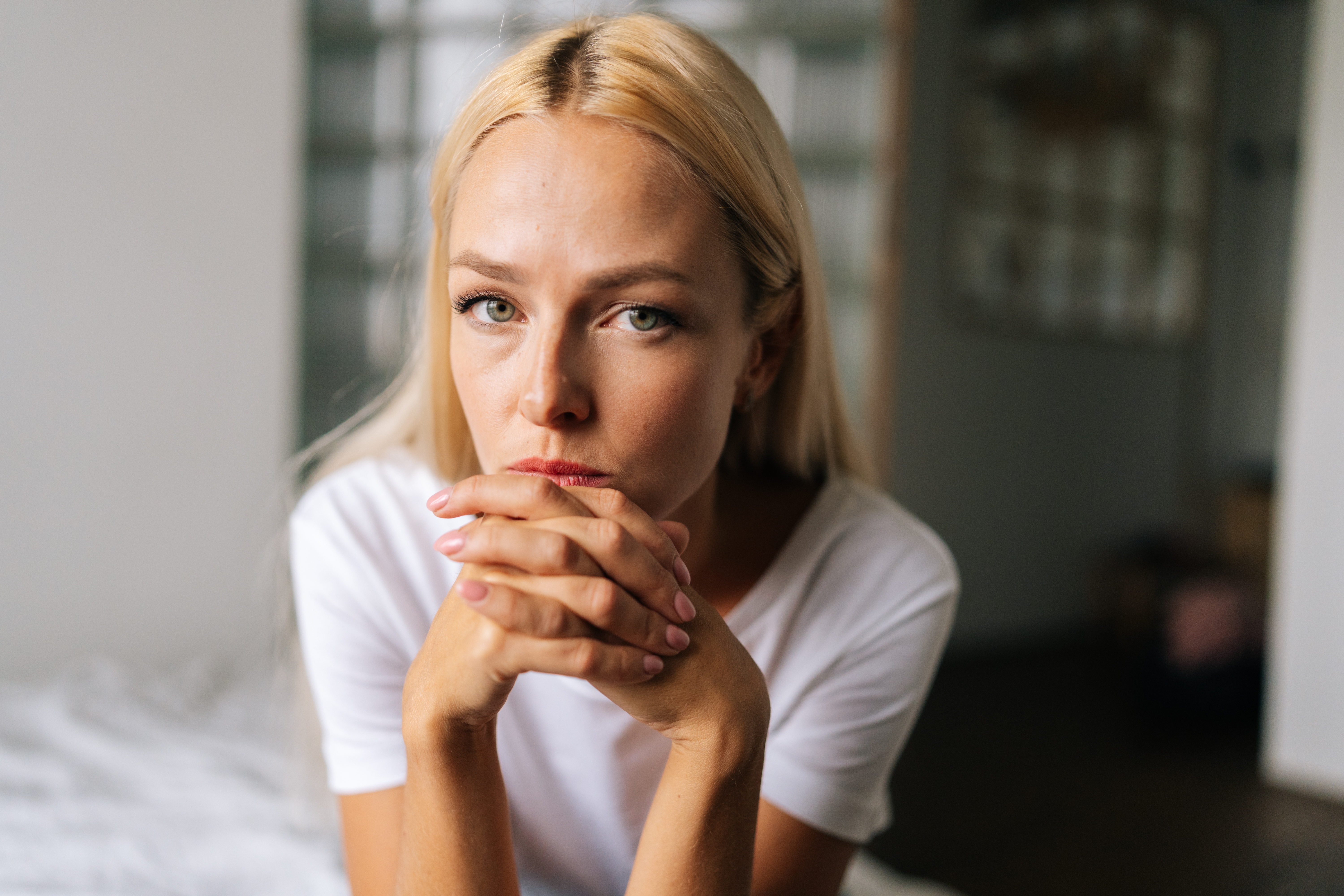 Close up face of thoughtful blonde female | Source: Shutterstock
