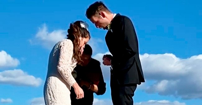 Andrew and Marlee Kent reacting to the ring falling off the pier during their wedding ceremony | Photo: Getty Images