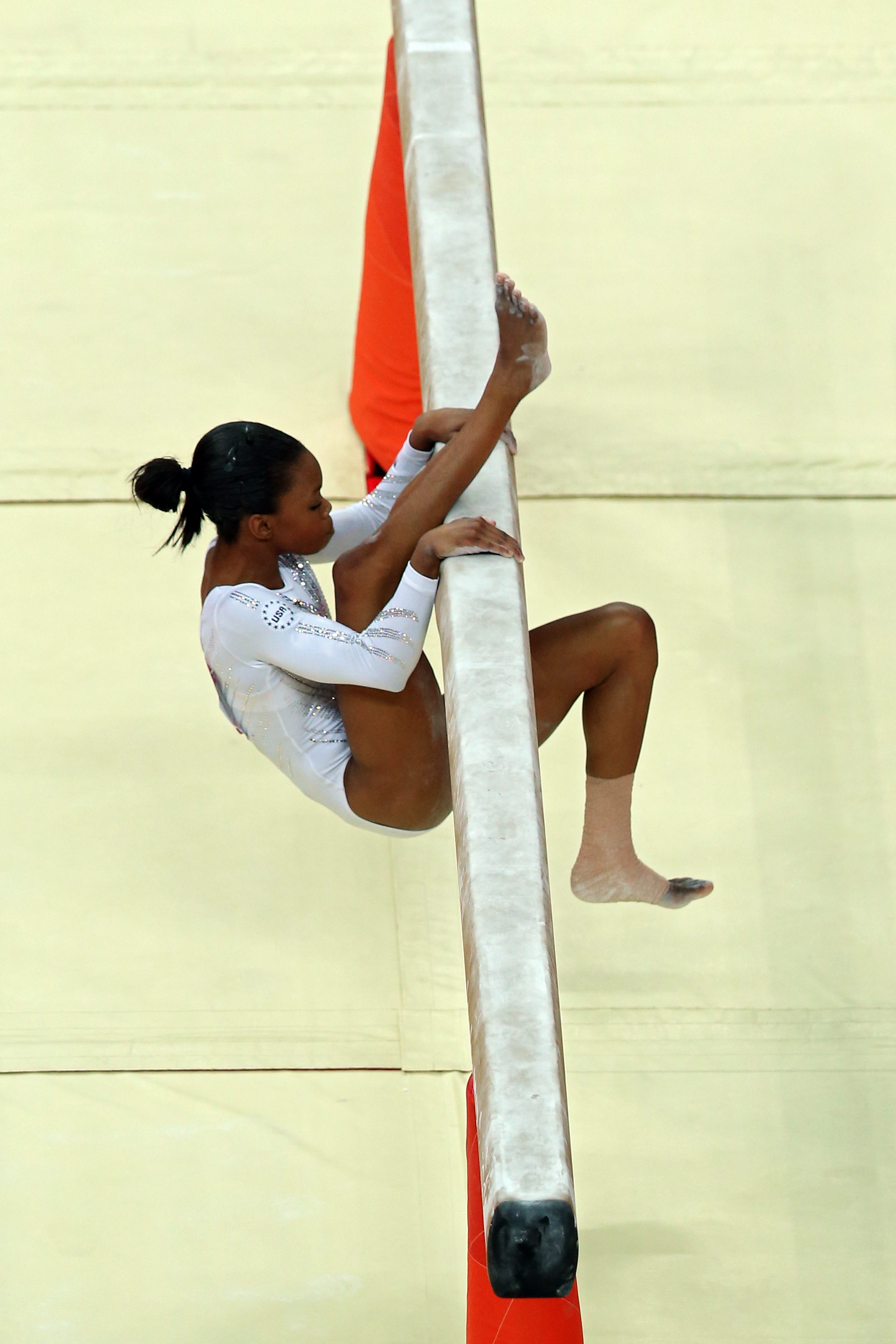 Gabrielle Douglas of the United States falls off the beam during the Artistic Gymnastics Women's Beam final on Day 11 of the London 2012 Olympic Games at North Greenwich Arena on August 7, 2012 in London, England. | Source: Getty Images