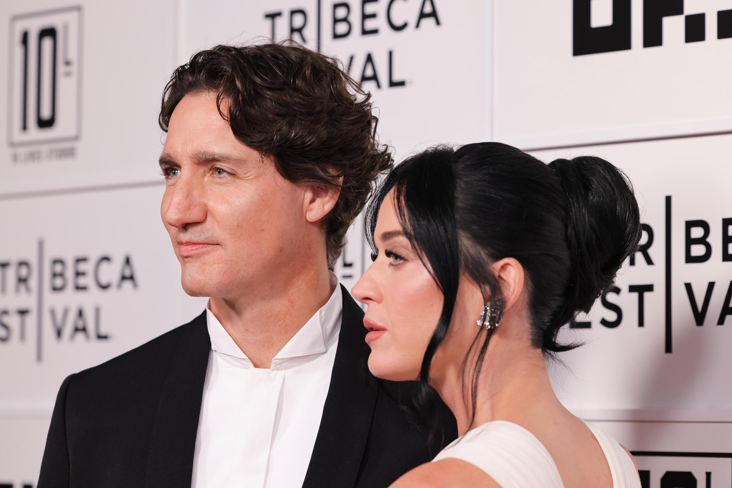 A quieter moment amid the flashbulbs. Katy Perry and Justin Trudeau looked off-camera while posing side-by-side, offering a candid glimpse of the pair during their highly anticipated red carpet debut. | Source: Getty Images