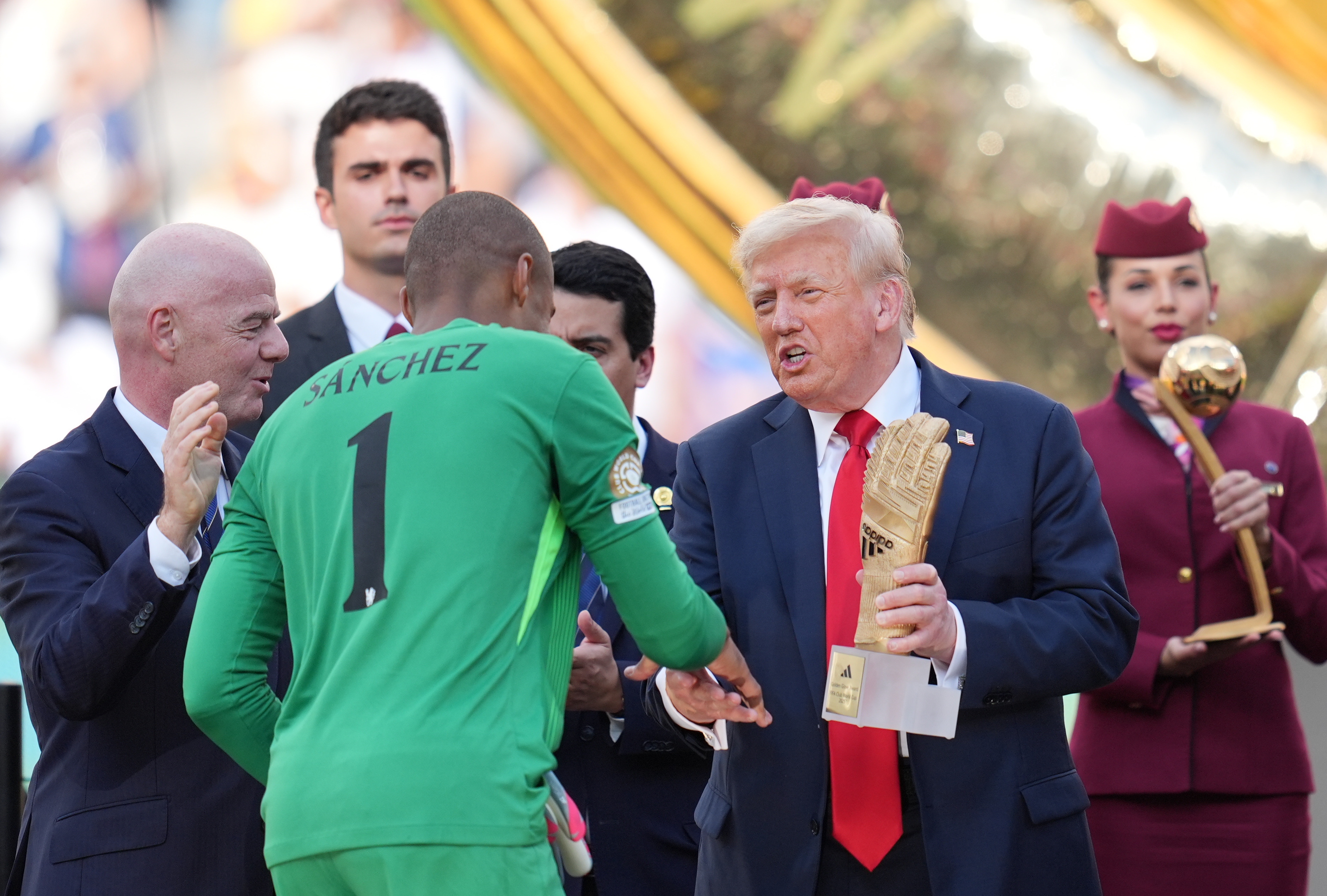 Gianni Infantino and Donald Trump presenting medals to players on July 13, 2025, in New Jersey. | Source: Getty Images
