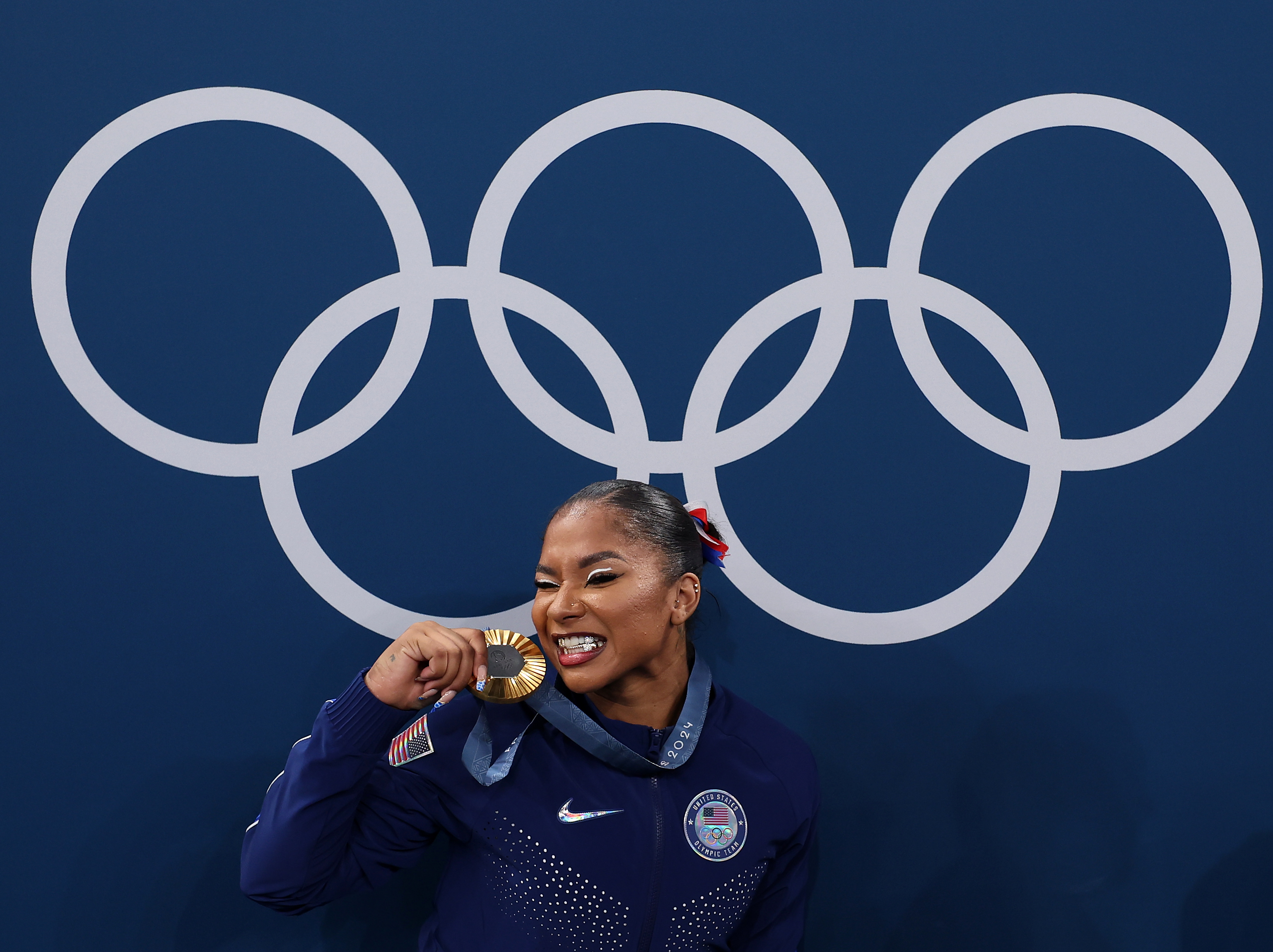 Gold medalist Jordan Chiles poses with the Olympic Rings during the medal ceremony at the Paris 2024 Olympics on July 30, 2024 | Source: Getty Images