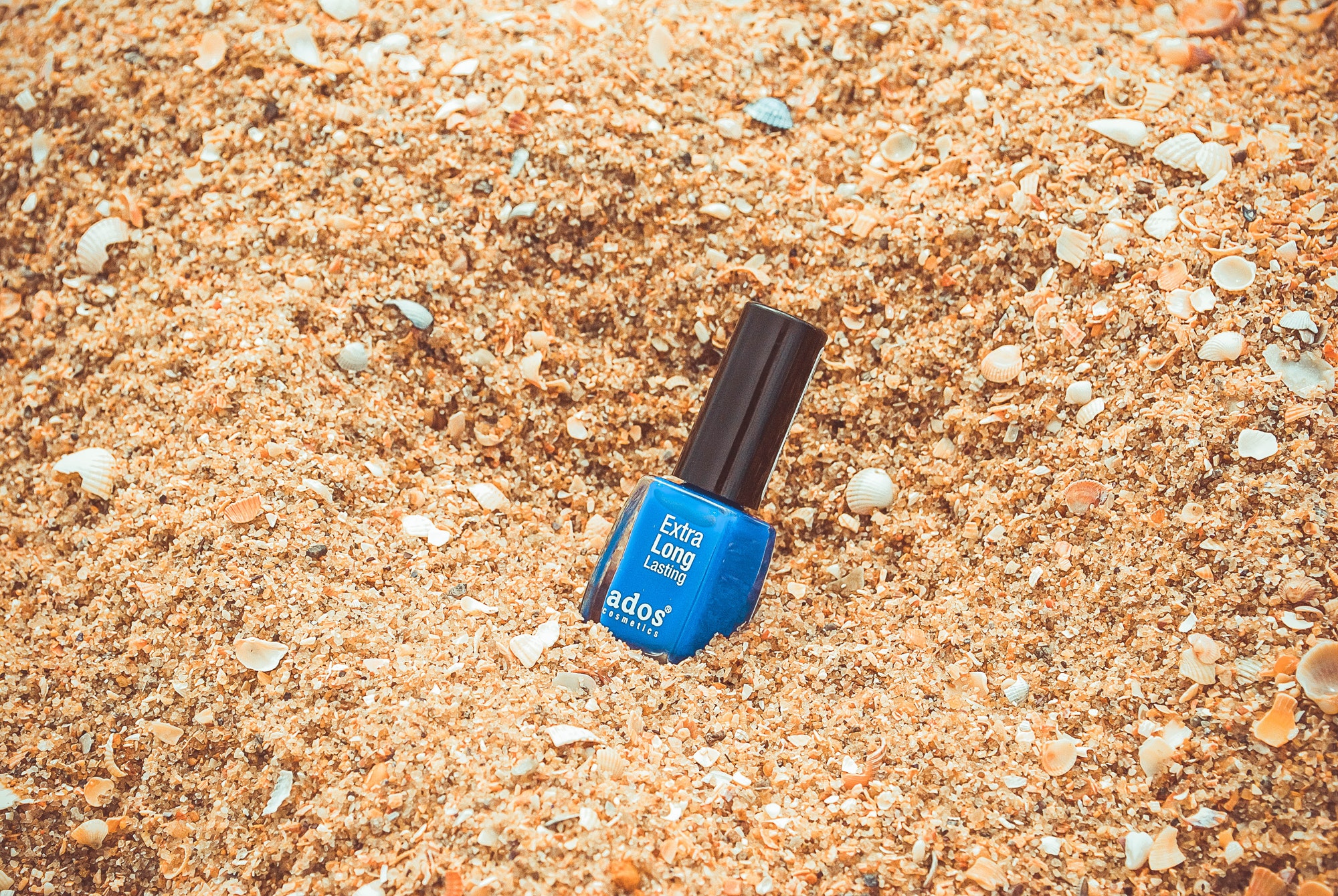 An image of a blue colored nail polish | Source: Pexels