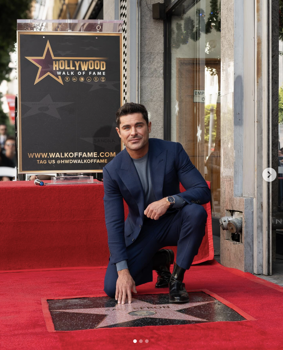 Zac Efron posing with his star on The Hollywood Walk of Fame in a photo he shared on December 12, 2023 on his social media | Source: instagram/zacefron